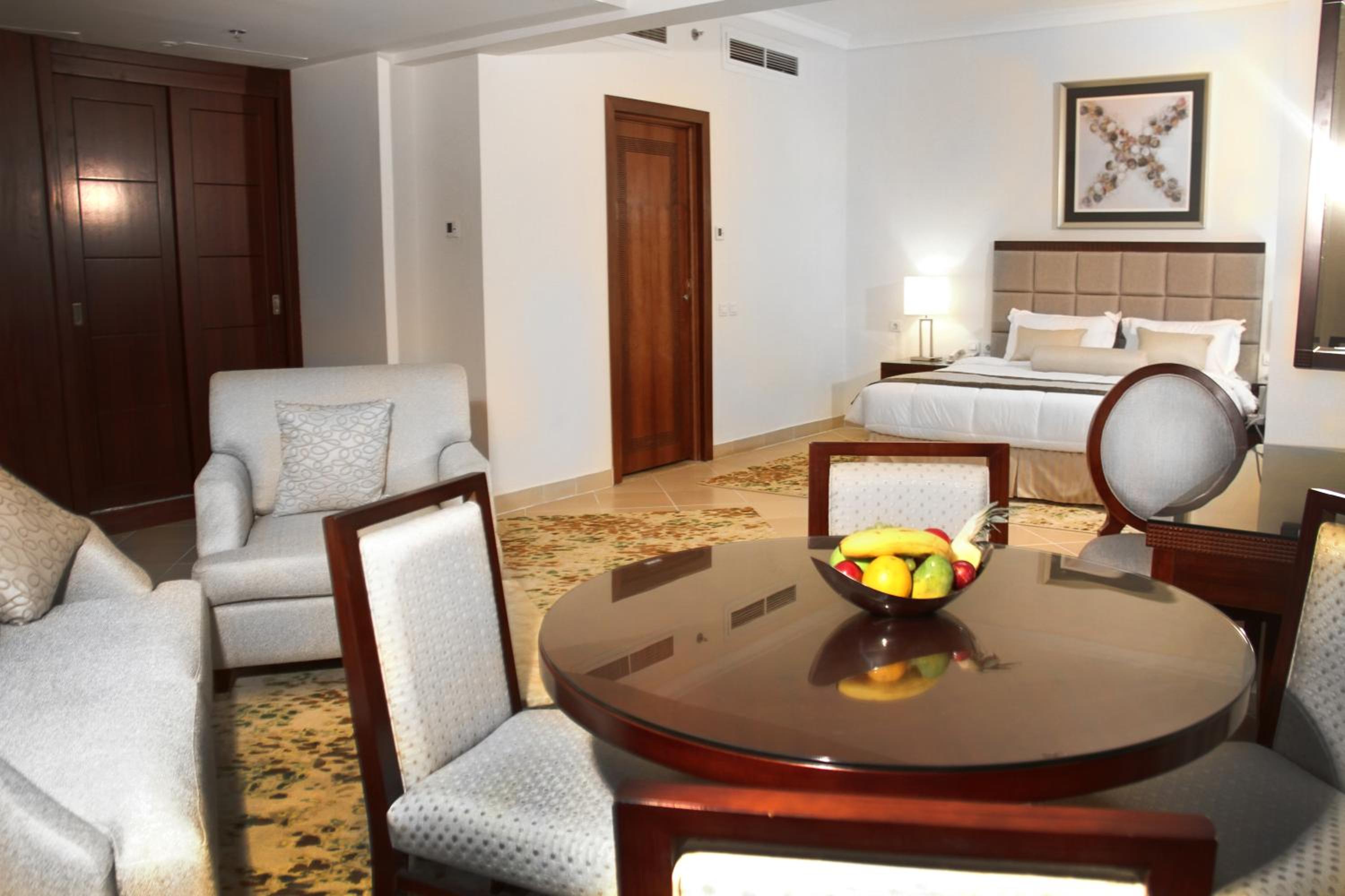 One-Bedroom Suite with Sea and Pool View
