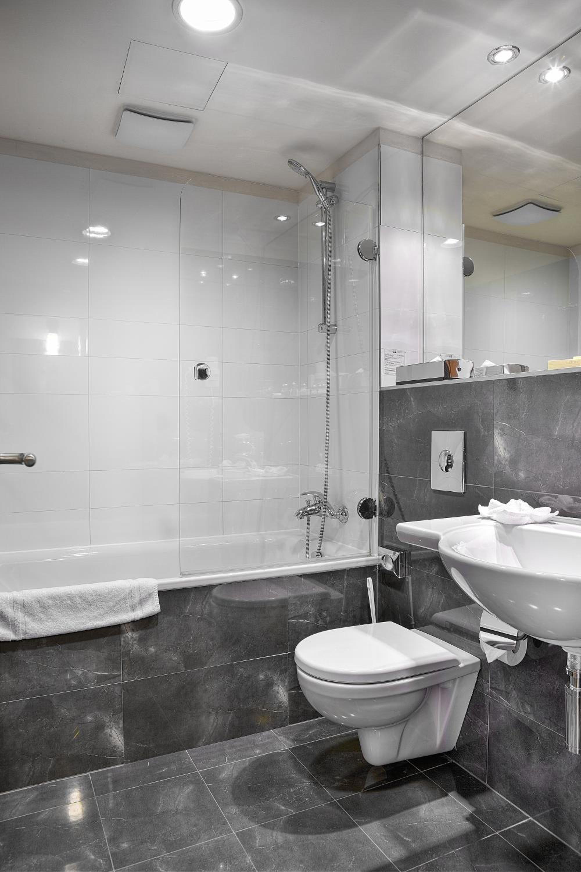 Relax in a sleek, modern bathroom oasis.