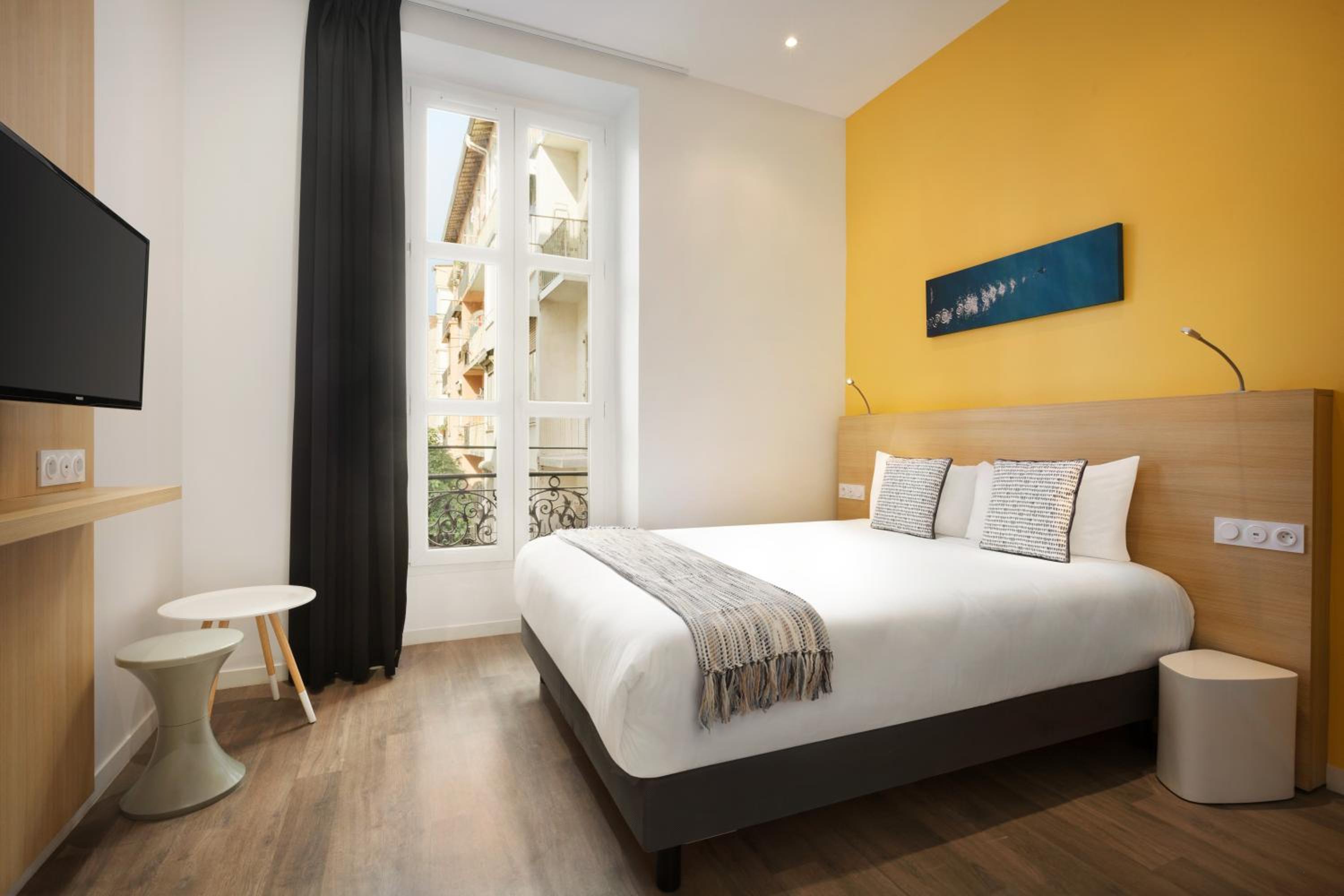 Modern comfort awaits in this stylish hotel room!