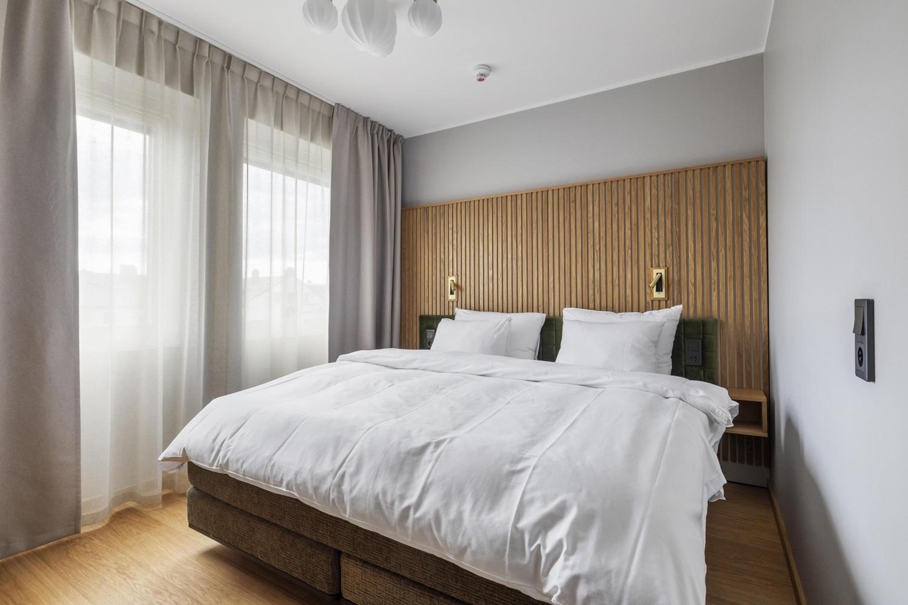 Family Room with One King Bed and One Wall Bed - Non-Smoking photo 1