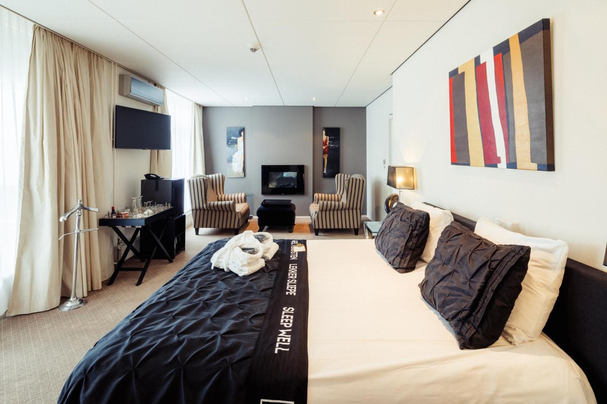 King Suite with Balcony - Photo 1