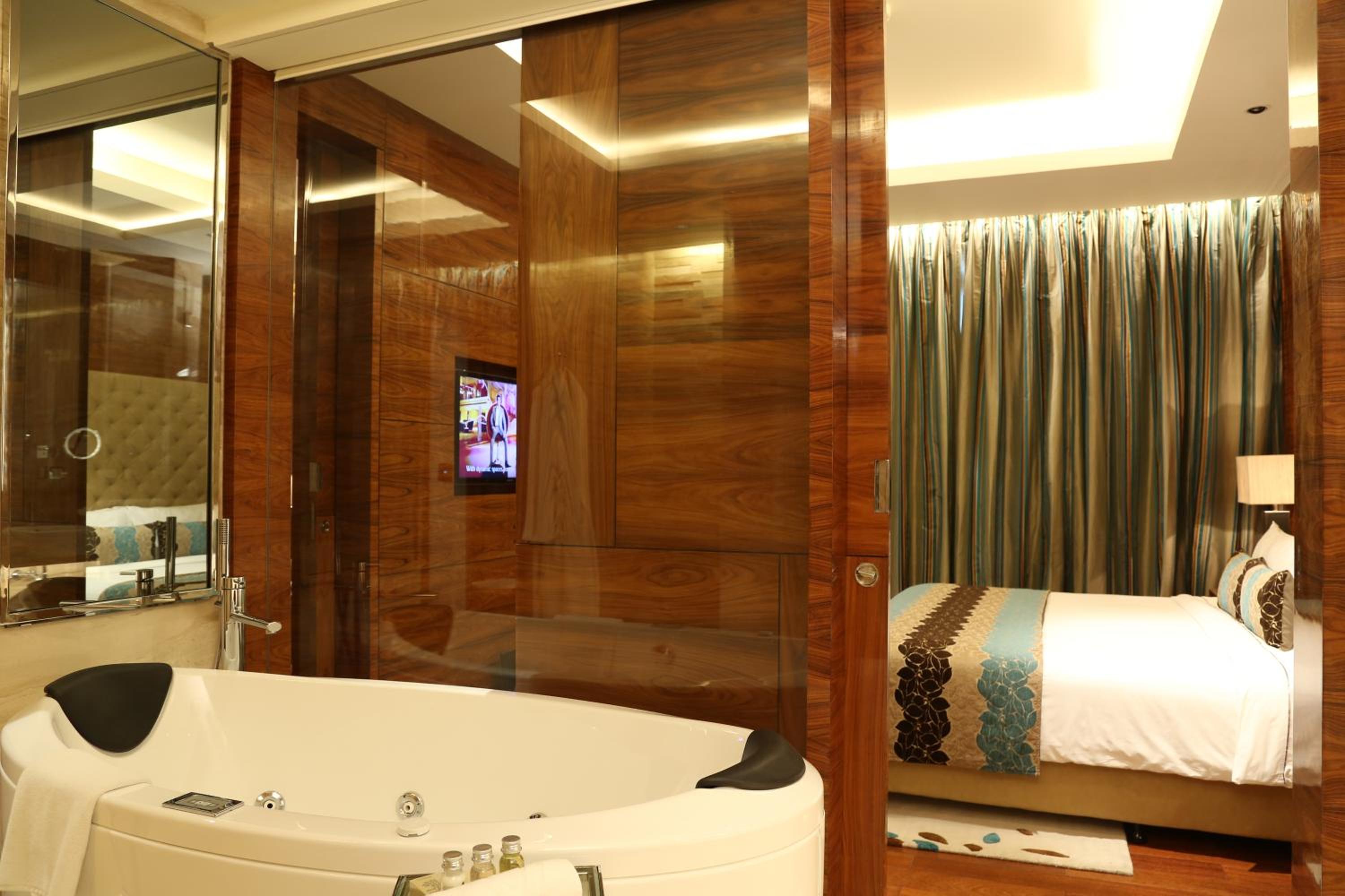 Luxury Suite with One way Airport Transfer, Butler service on request.02 Pcs of Ironing per day,20 % disc on FNSB,SPA & transportation, Cocktail Hours @ Club Lounge from 18:00 hrs to 20:00 hrs, 2 hours of boardroom usage per stay subject to availability Luxury Suite with One way Airport Transfer, Butler service on request.02 Pcs of Ironing per day,20 % disc on FNSB,SPA & transportation, Cocktail Hours @ Club Lounge from 18:00 hrs to 20:00 hrs, 2 hours of boardroom usage per stay subject to availability