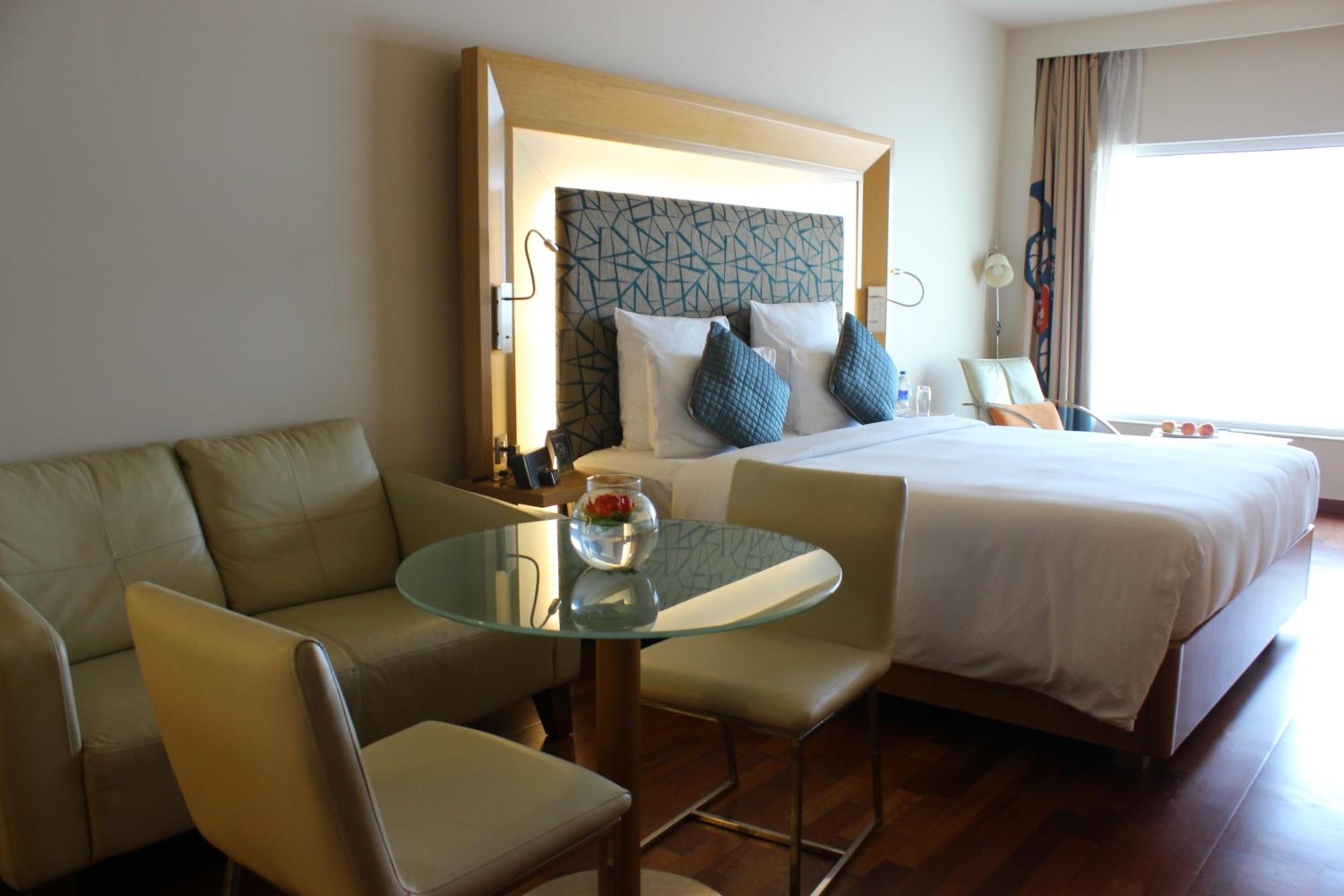 Premier Room with 1 King Bed Ocean View with Premier Lounge Access along with 2 Pieces of Laundry per room per night on non-cumulative basis.