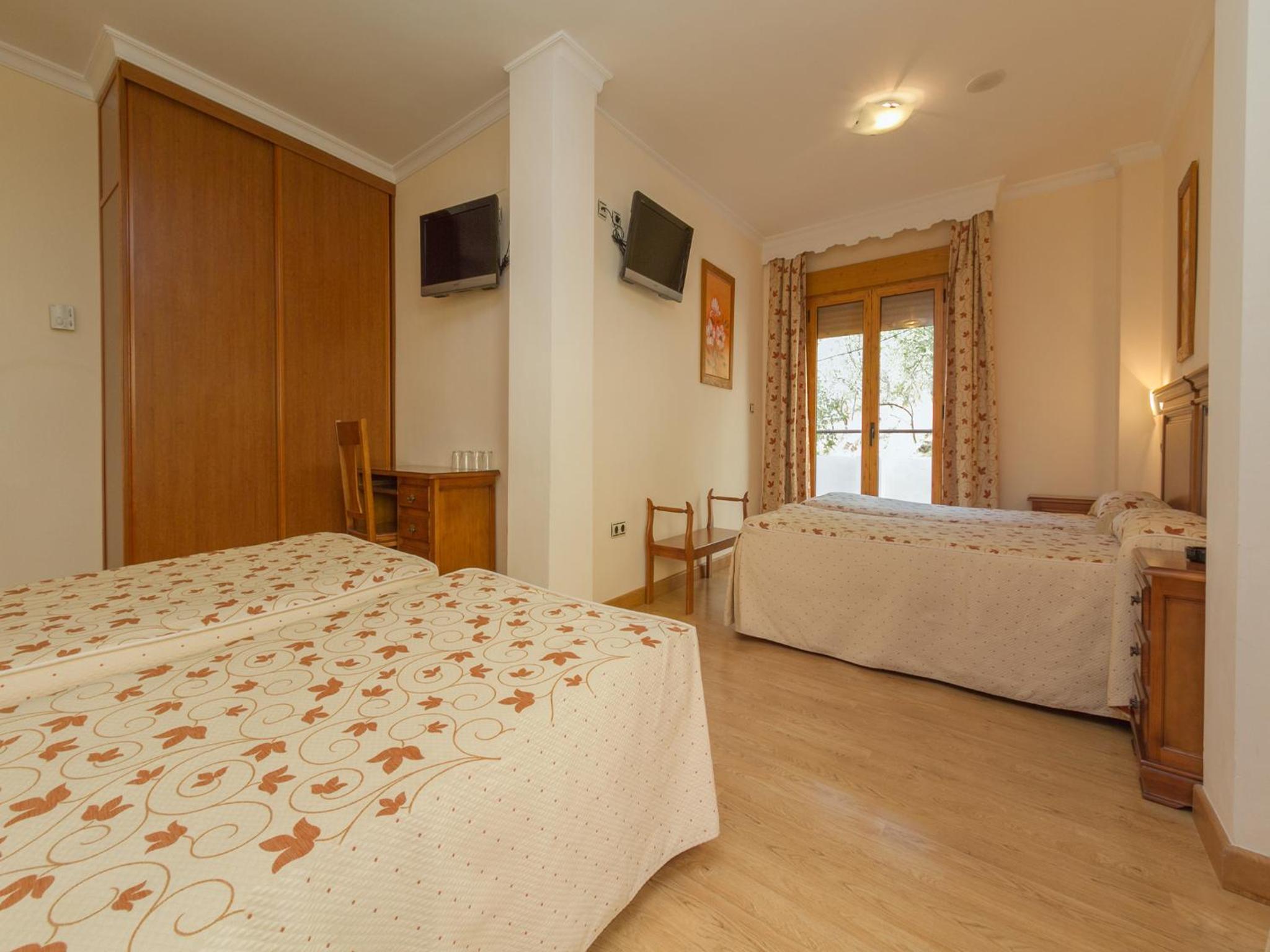 Habitación Cuádruple (2 Adultos + 2 Niños)