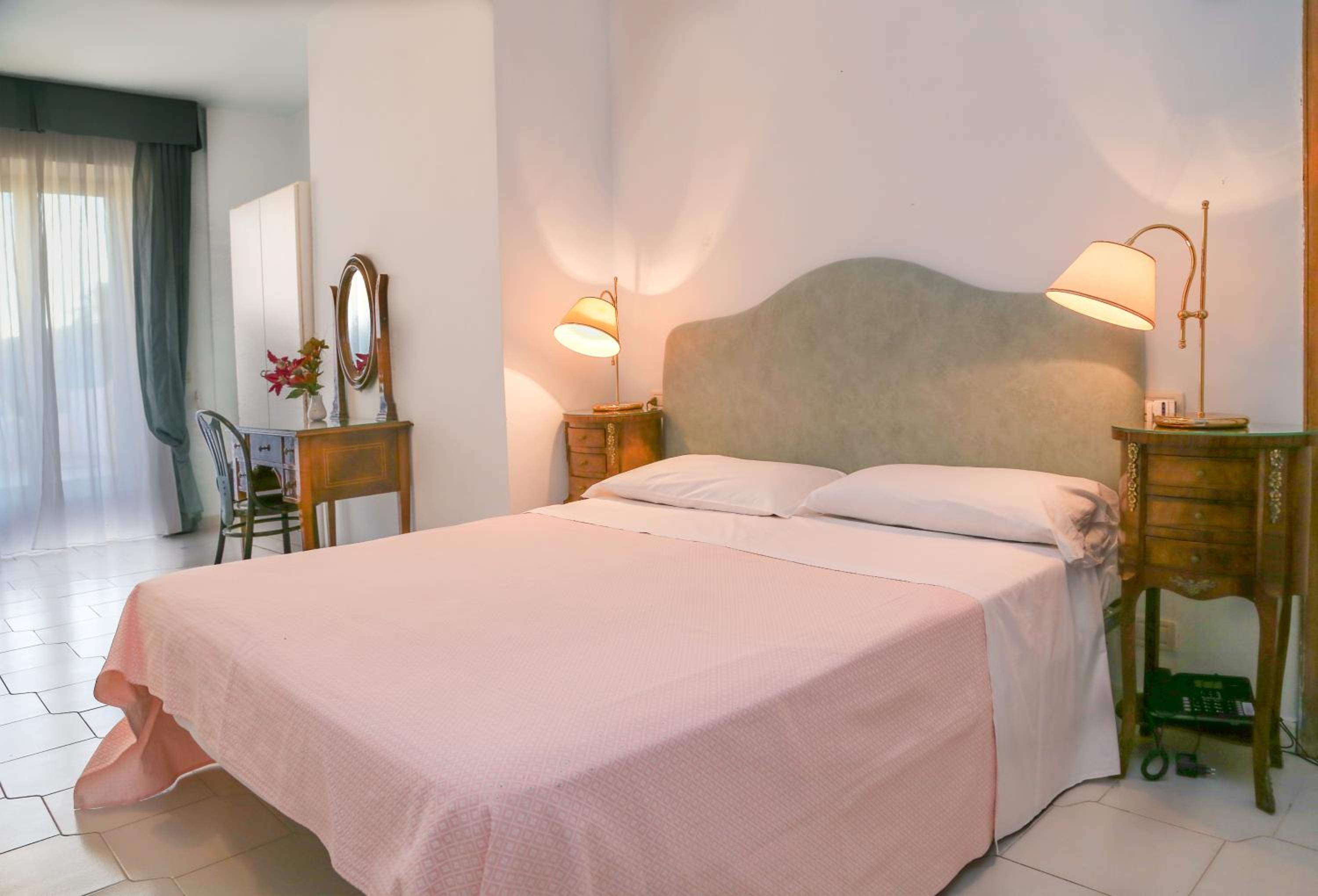 Relax in this cozy, inviting hotel room.