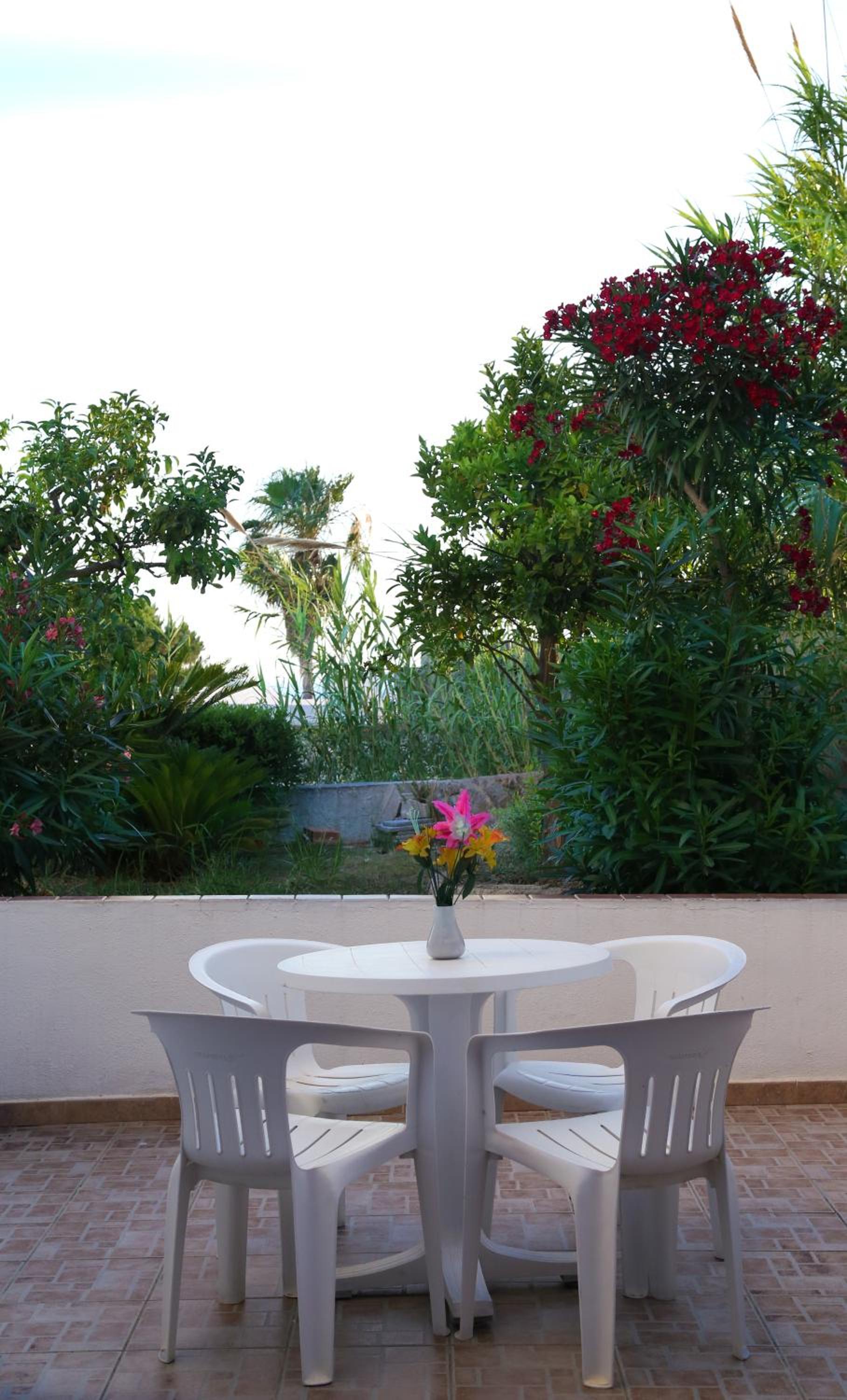 Relax on your private terrace surrounded by lush greenery!