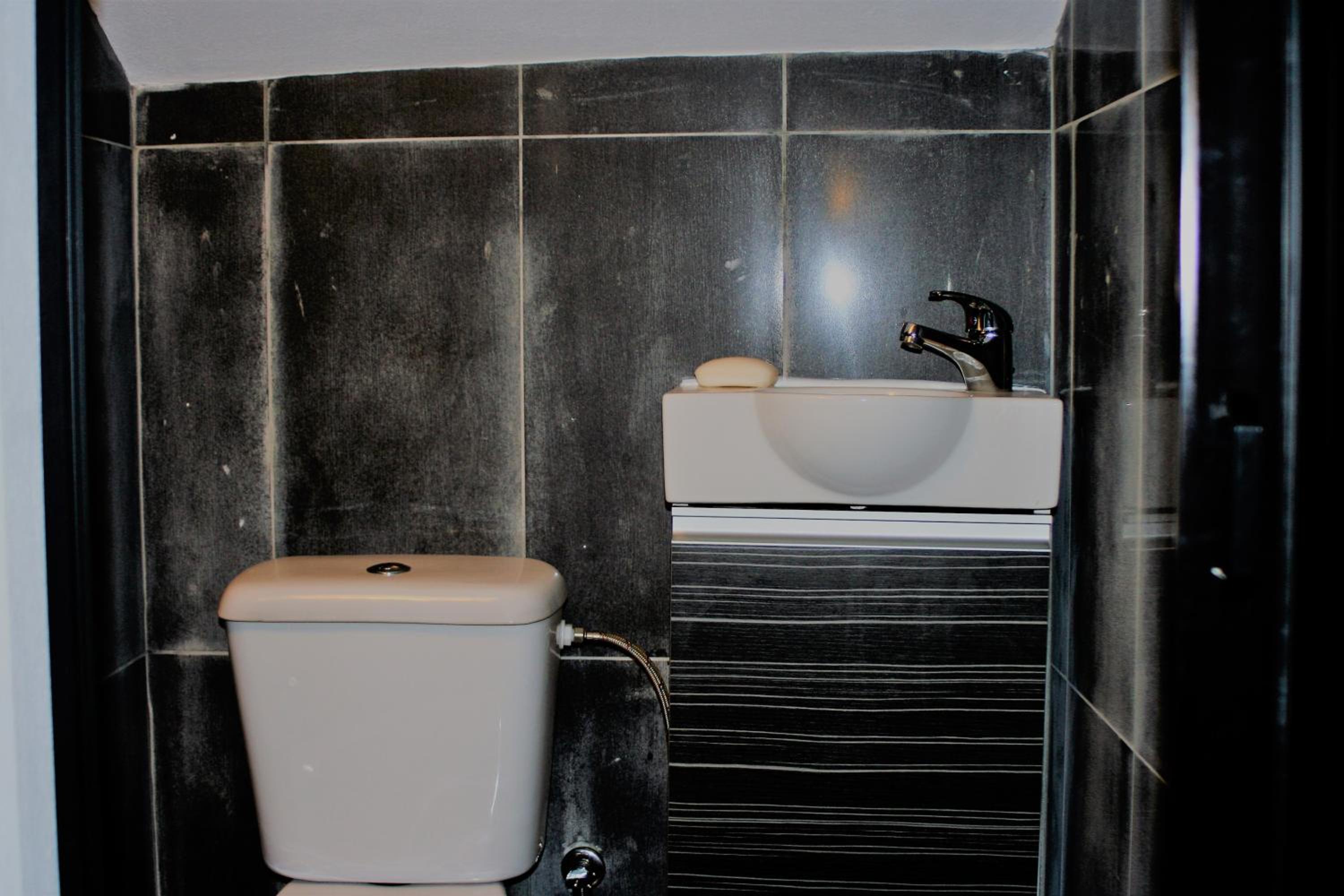 Three-Bedroom House - Photo 38