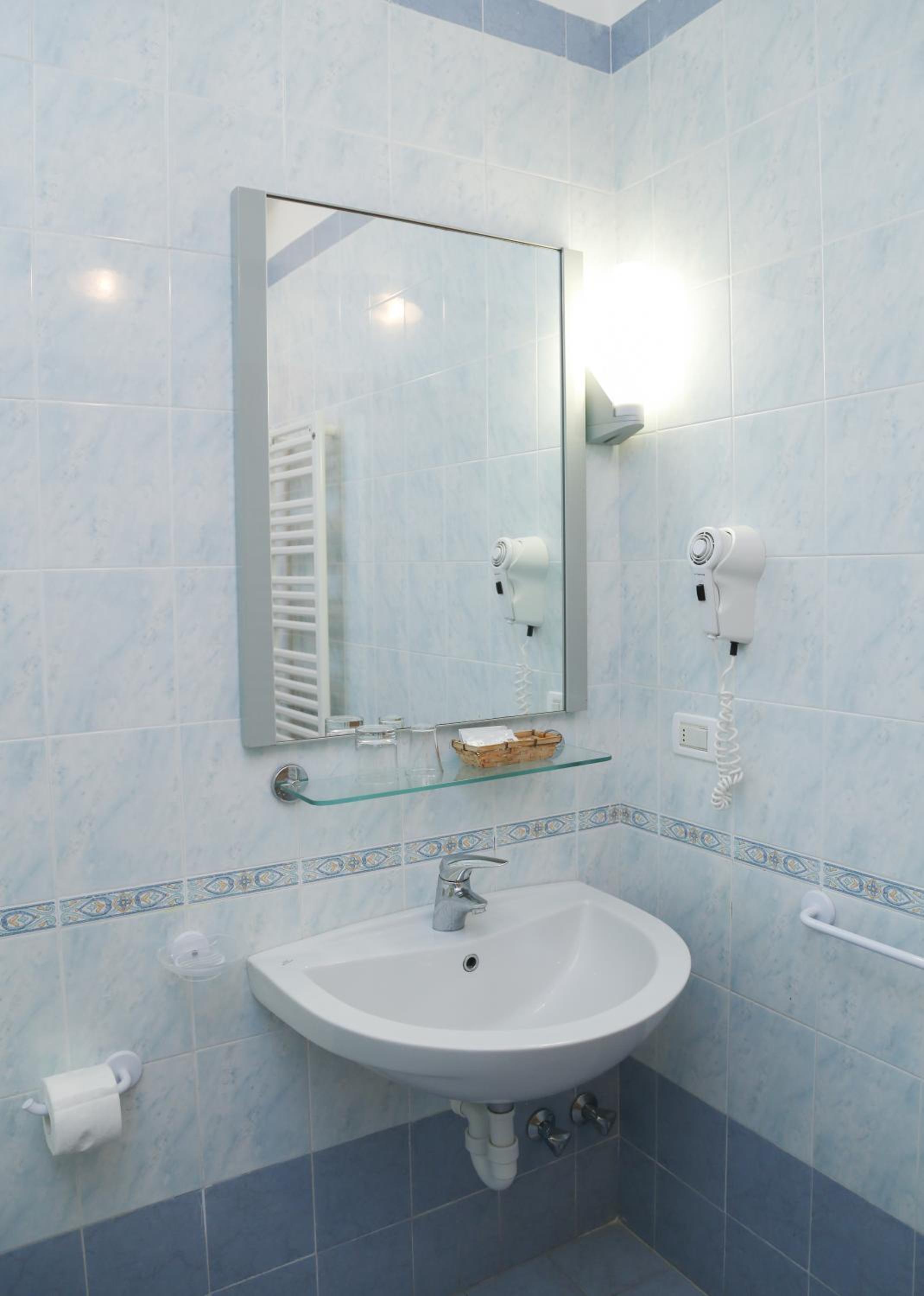 Refresh in this serene, modern bath space.