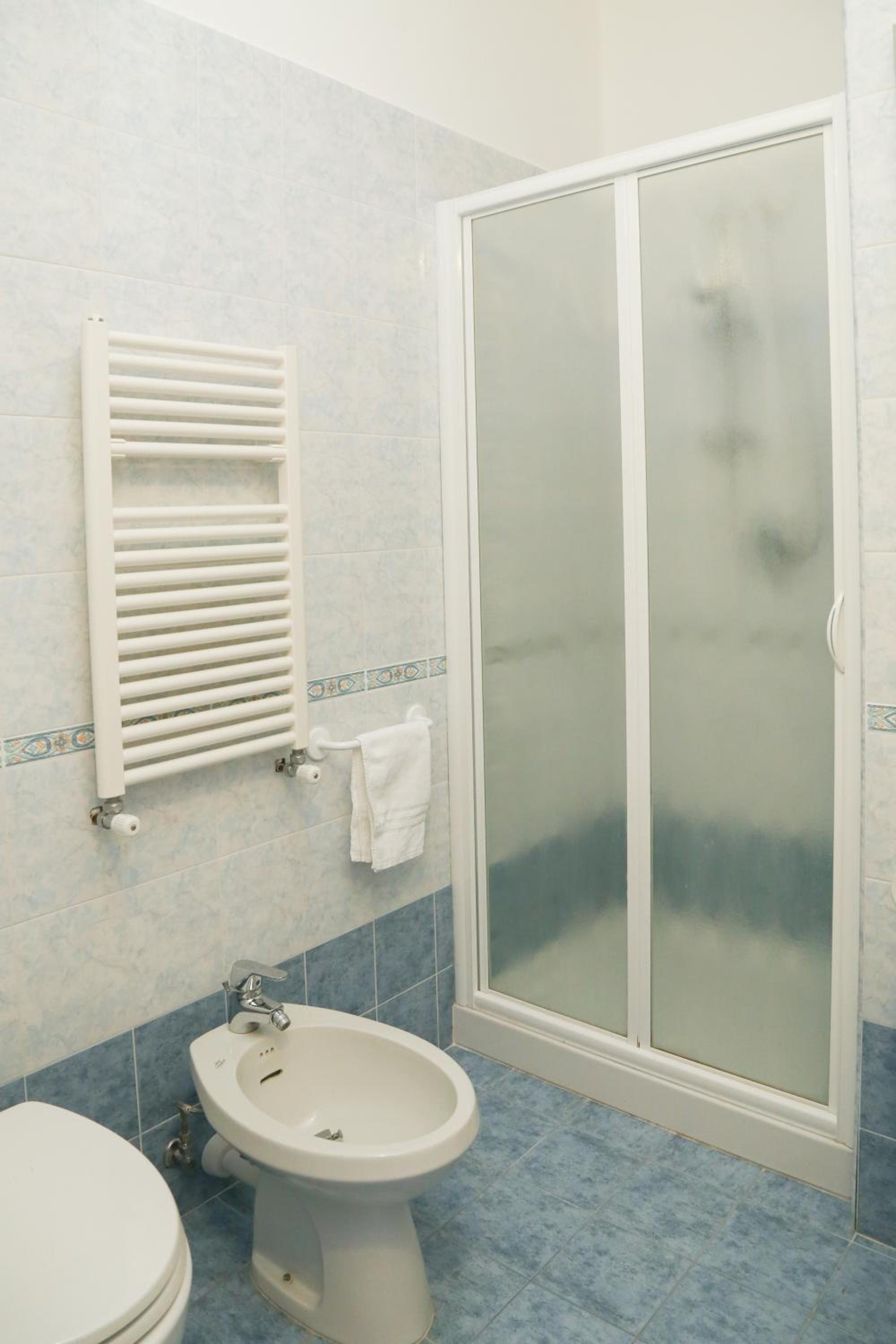 Relax in this pristine and inviting bathroom oasis.