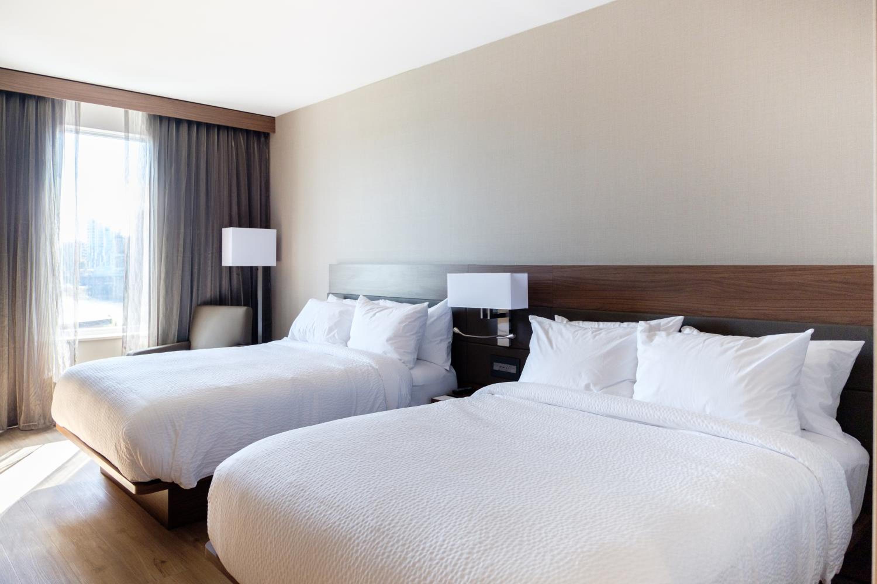Queen Room with Two Queen Beds - Hearing Accessible at AC Hotel by Marriott Cincinnati at The Banks in Cincinnati