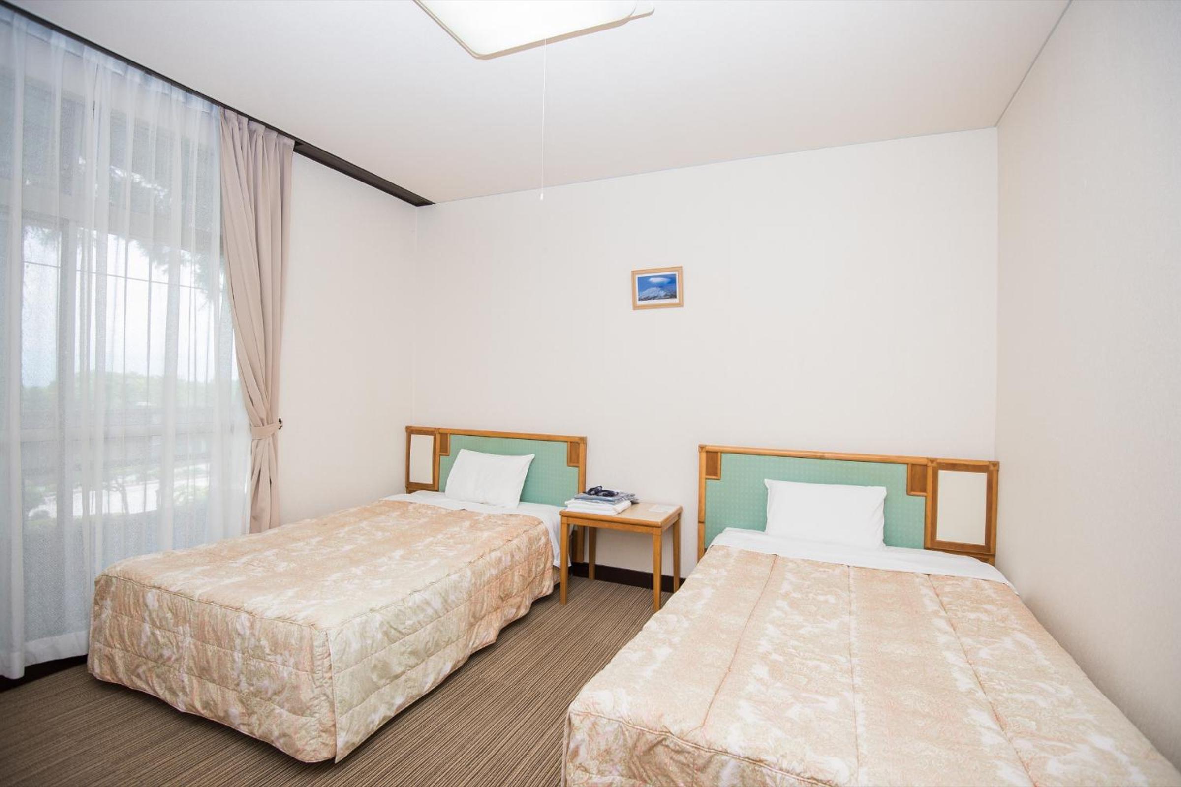 Twin Room With Shared Bathroom