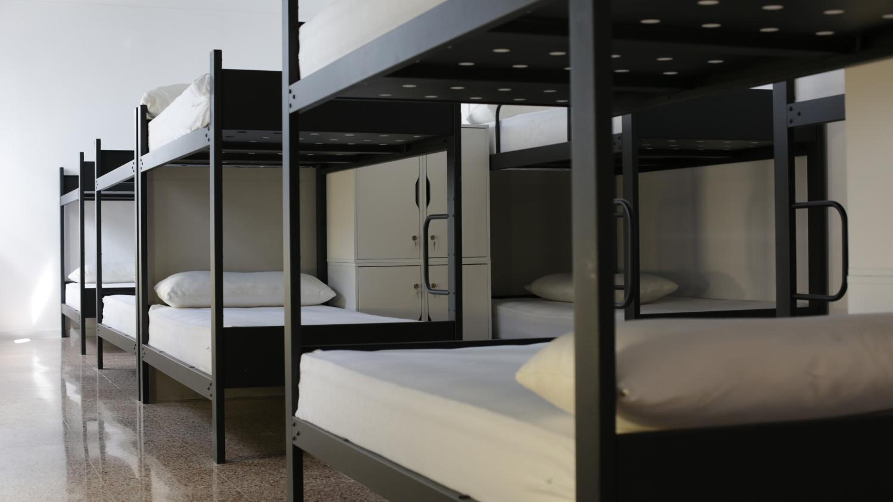 Cama en habitación compartida de 6 camas