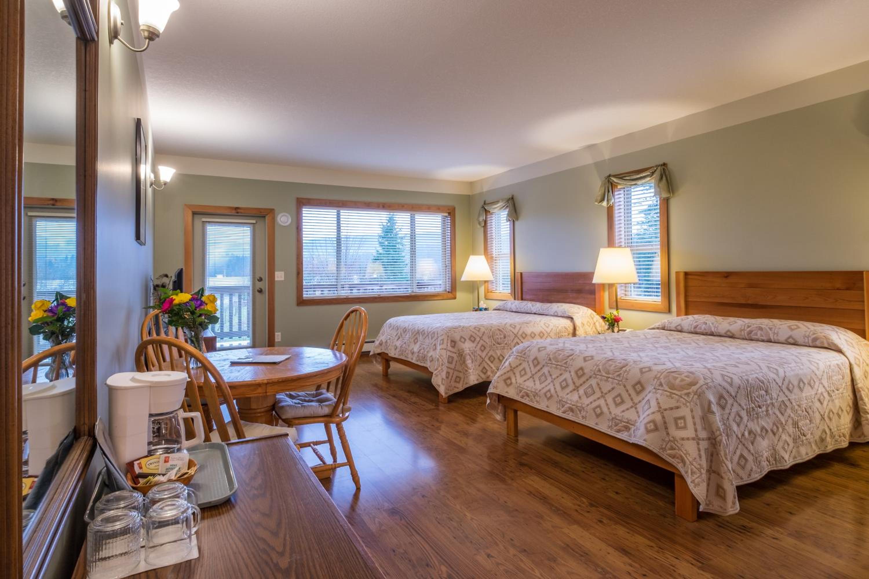 Deluxe Queen Room with Two Queen Beds and Balcony - Photo 1