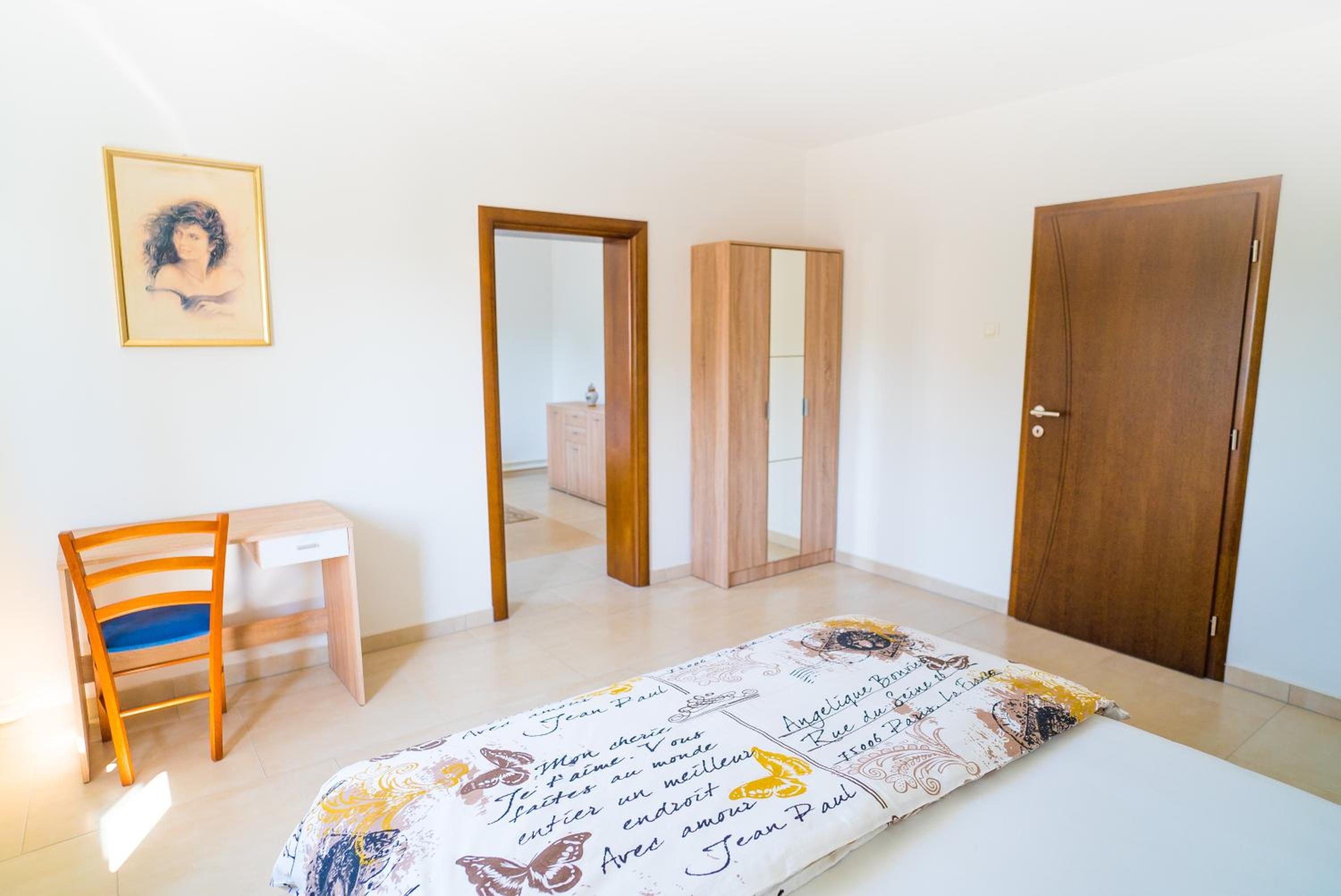 Three-Bedroom Apartment - Photo 10