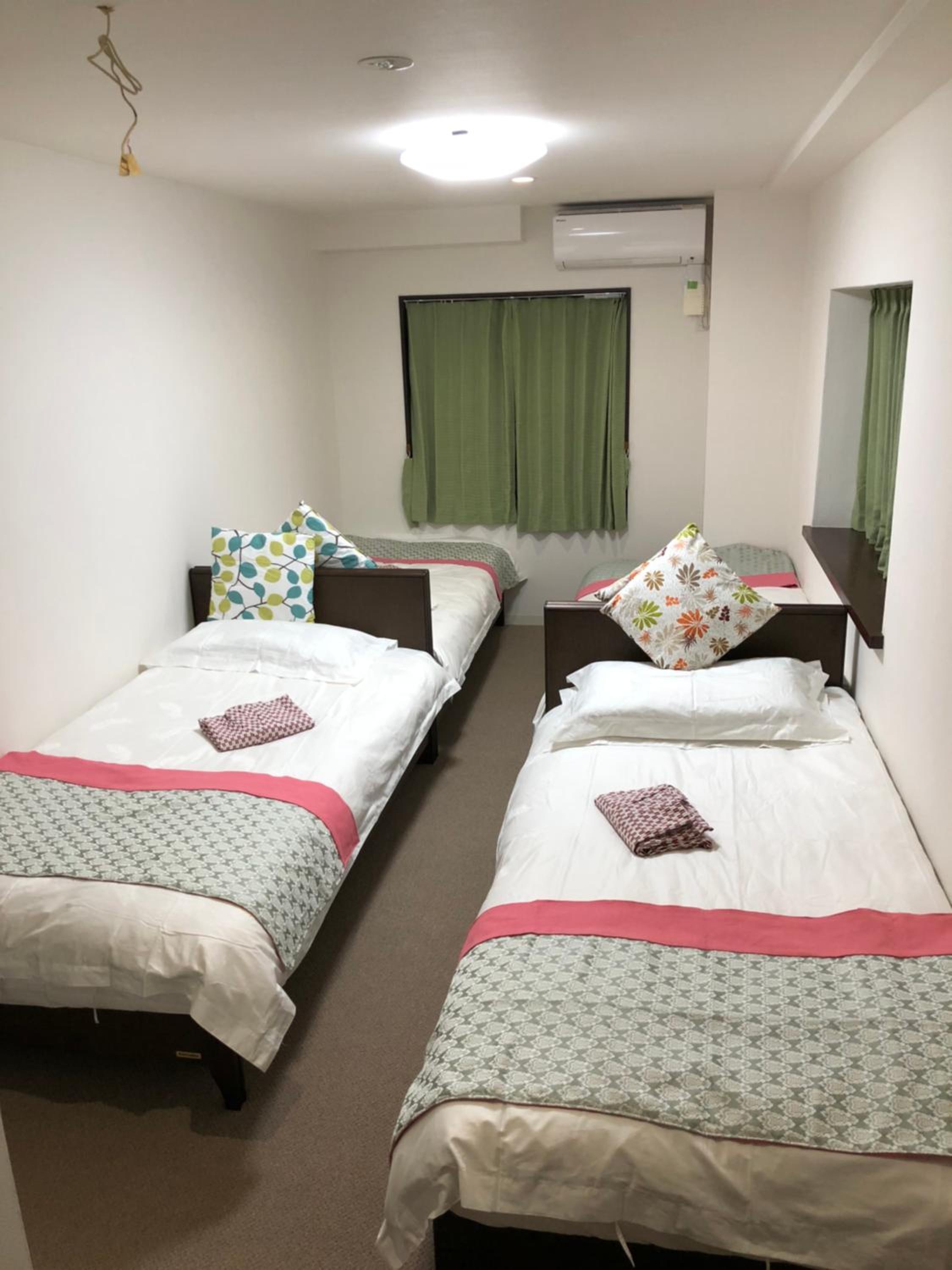 Quadruple Room with Private Bathroom