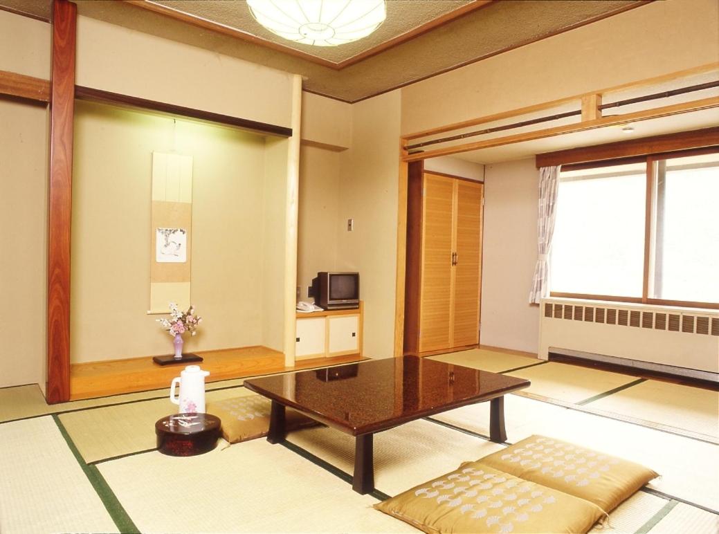 Japanese-Style Room with Tatami Area and Shared Bathroom photo 3