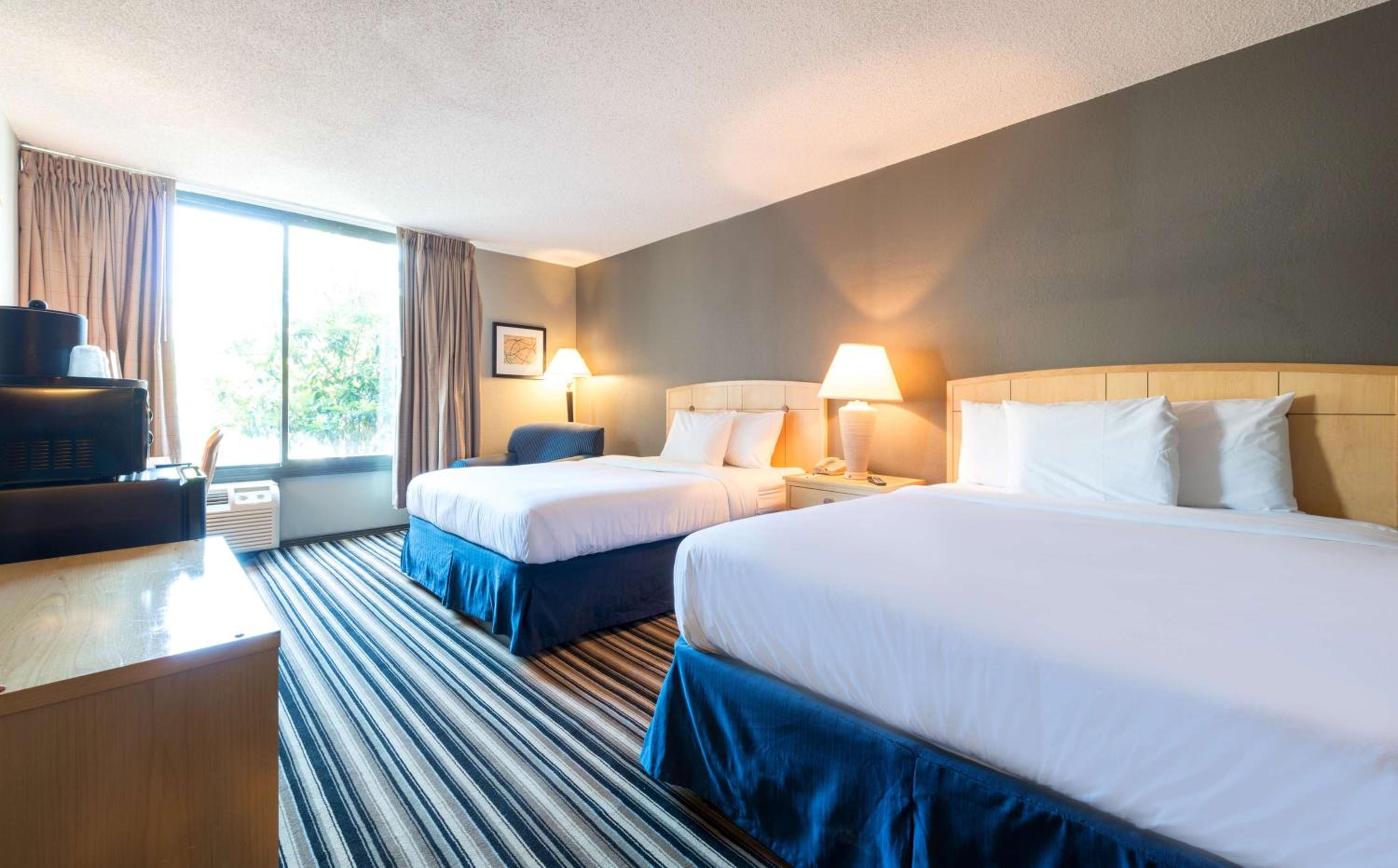 Deluxe Queen Room with Two Queen Beds - Non-Smoking photo 1