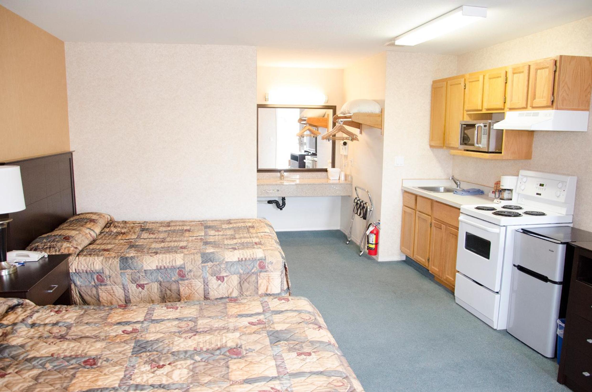 Queen Room with Two Queen Beds and Kitchen - Non-Smoking photo 1