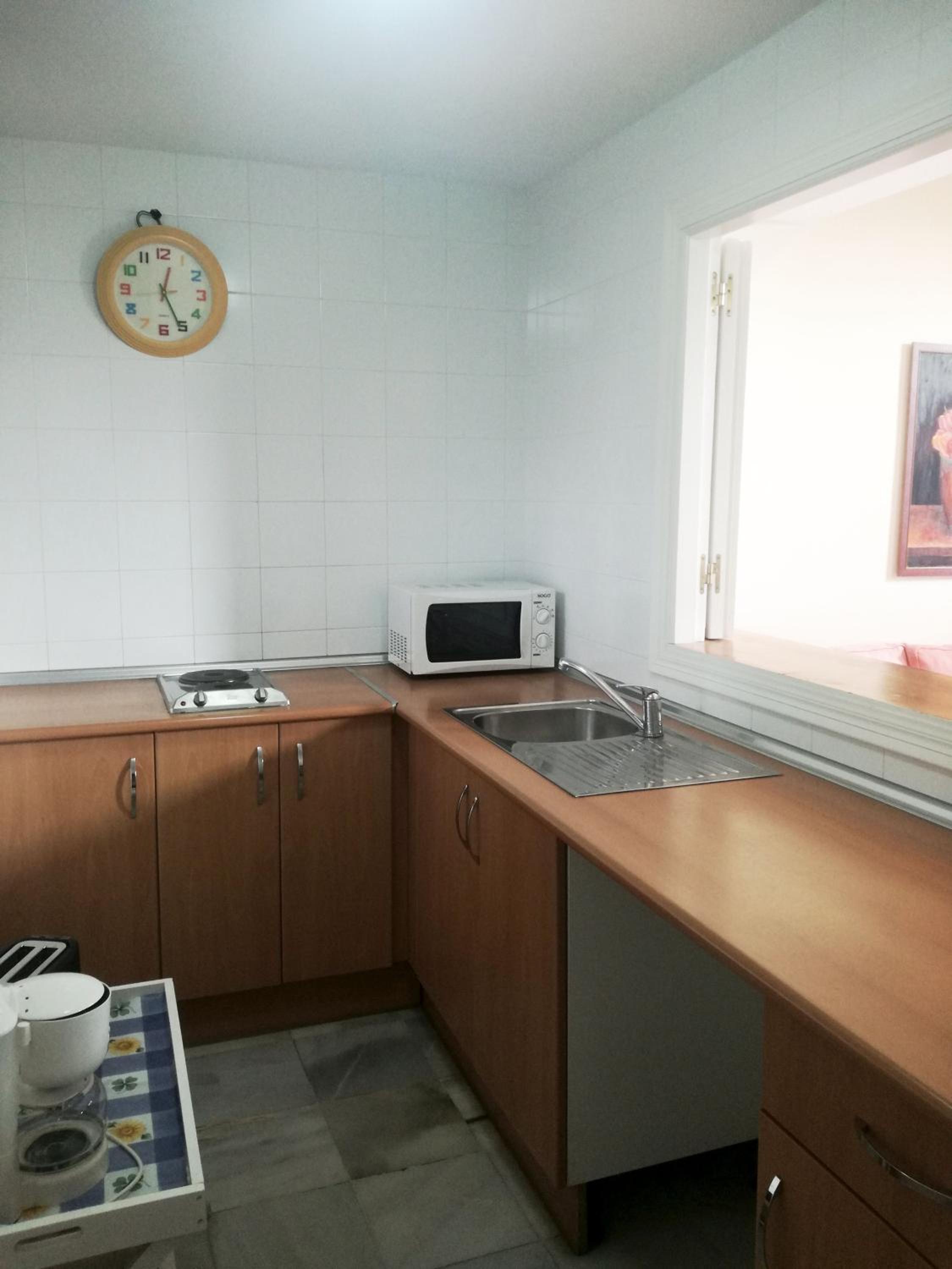 Three-Bedroom Apartment with Balcony - Photo 18