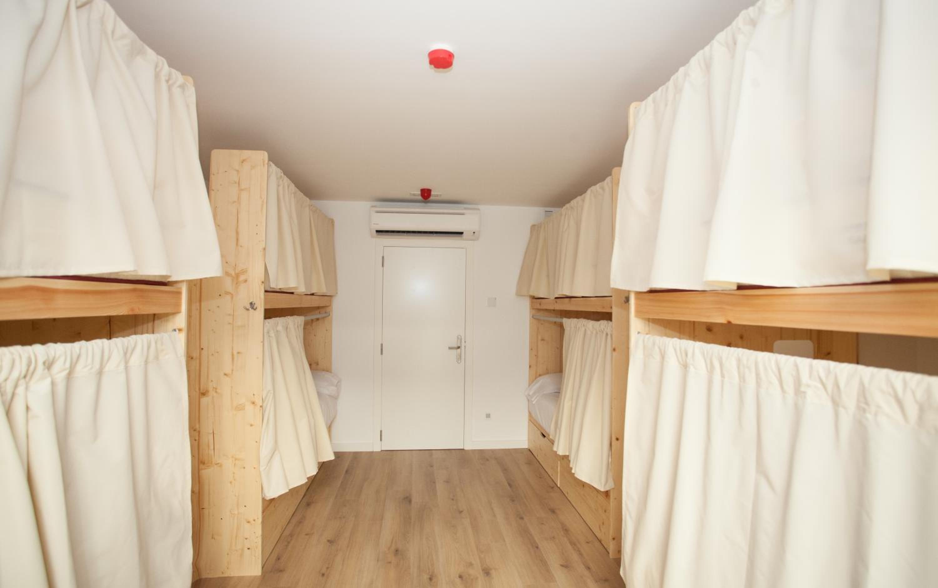 Cama en habitación compartida para 8 personas