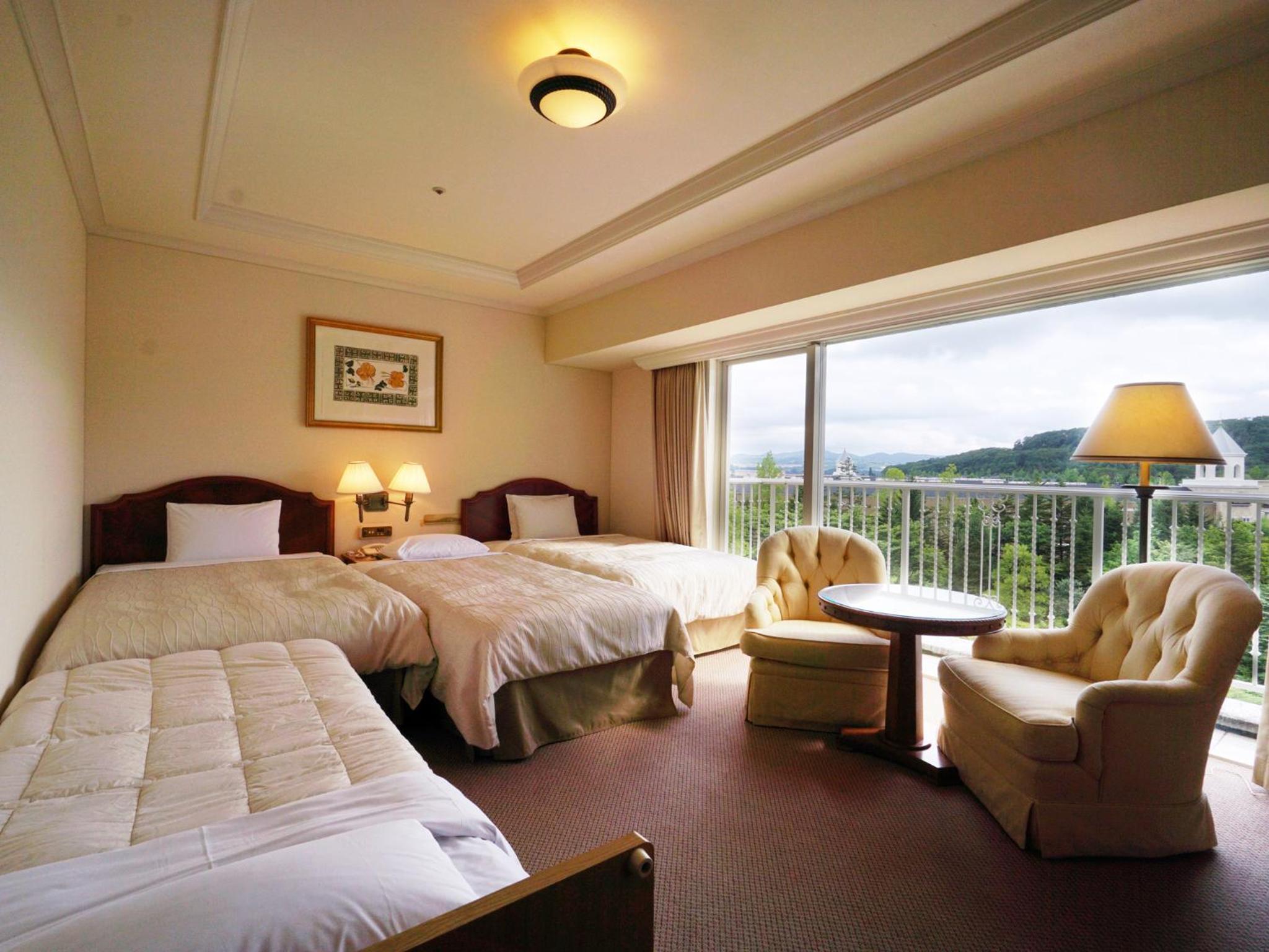 Luxury Twin Room with Two Extra Bed and Garden View - Non-Smoking