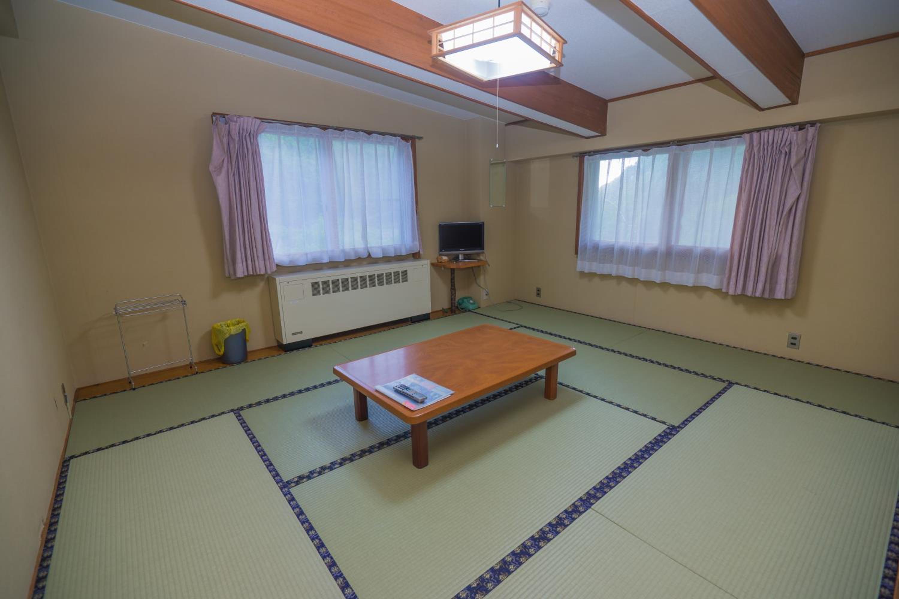 Japanese-Style Family Room with Shared Toilet photo 1