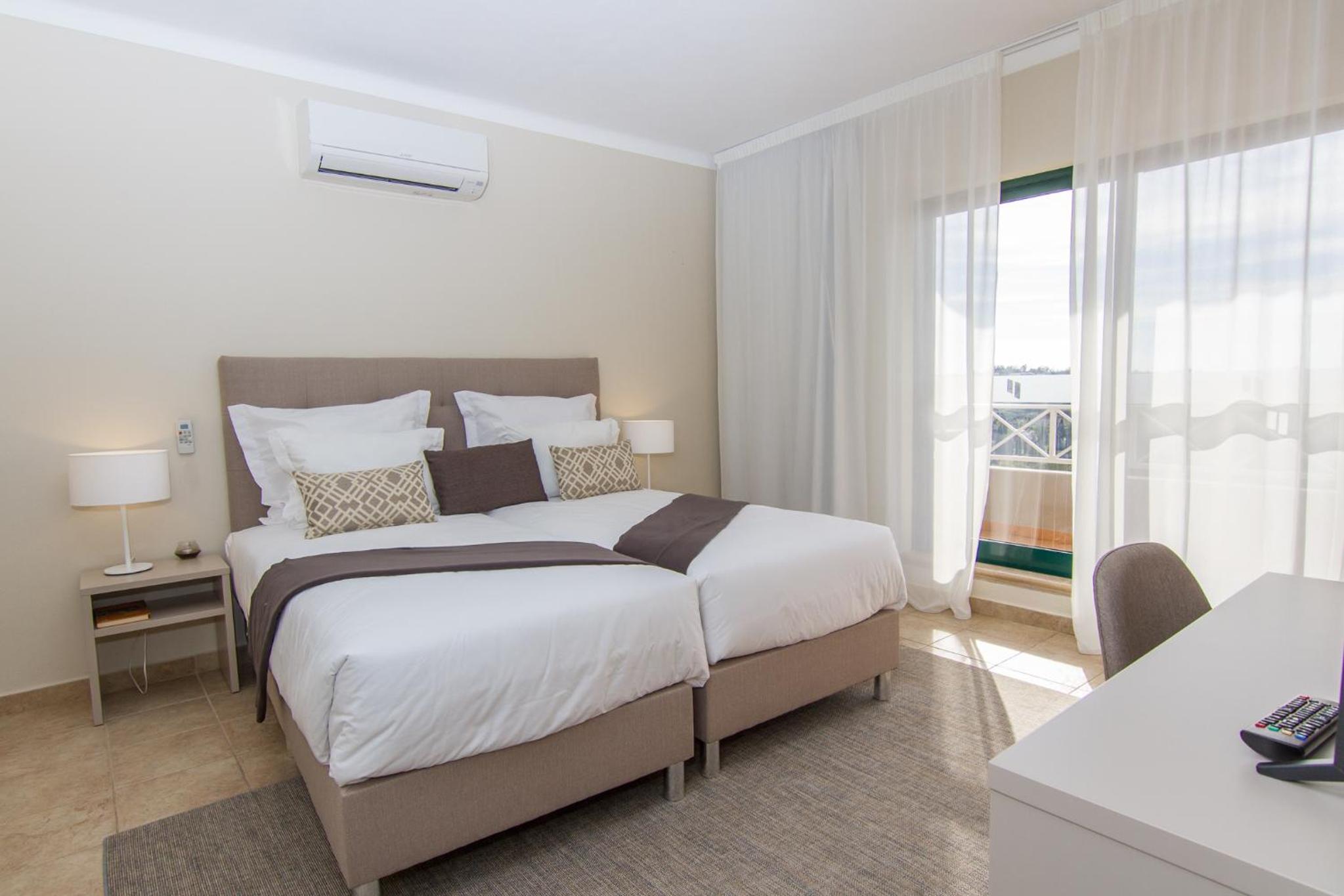 Two-Bedroom Triplex Apartment with Balcony