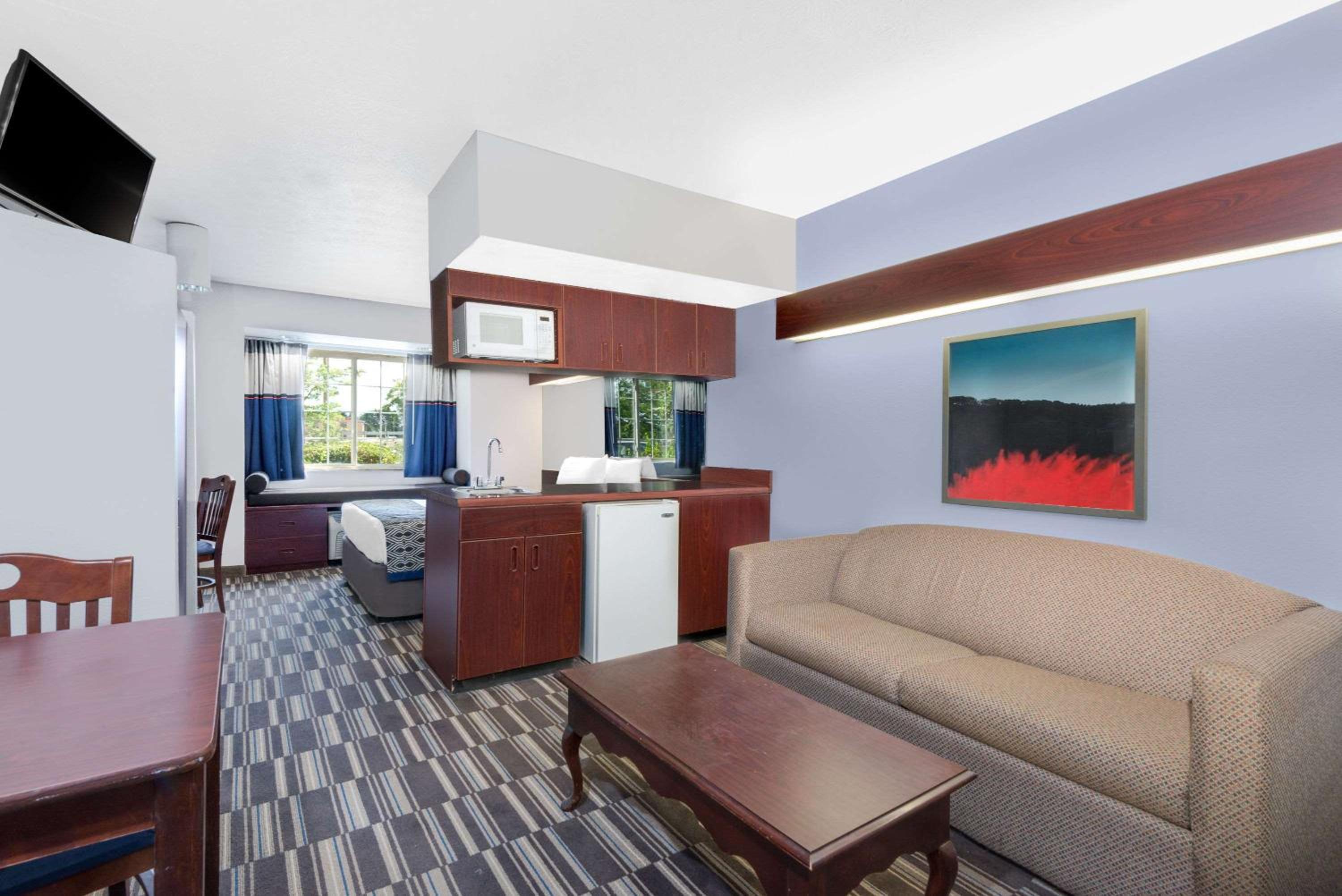 living room with a couch, coffee table and television
