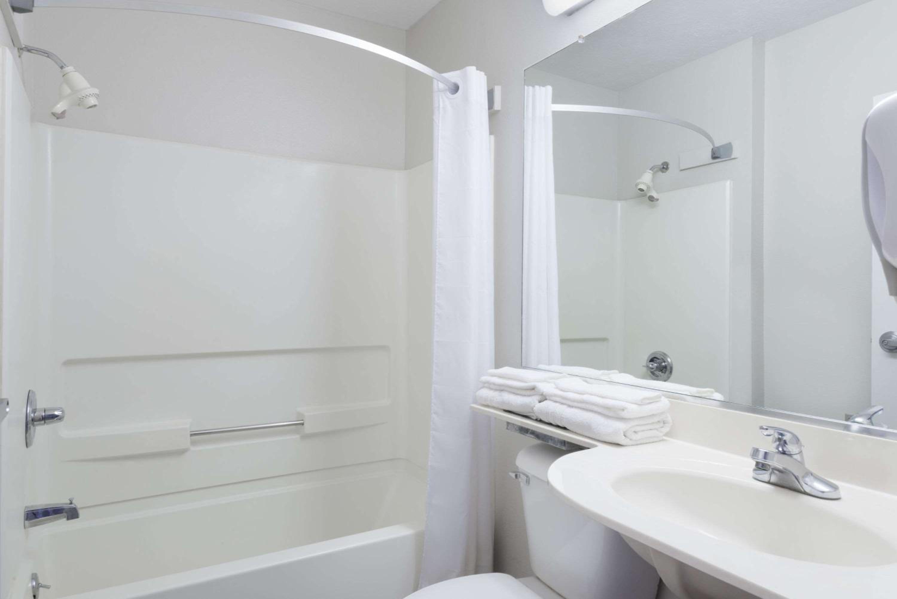 bathroom with a sink, toilet, and bathtub