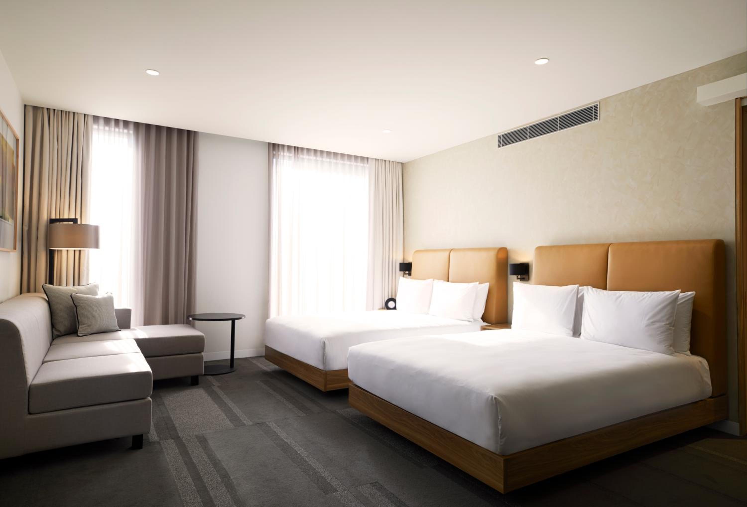 Queen Room with Two Queen Beds and Sofa - High Floor