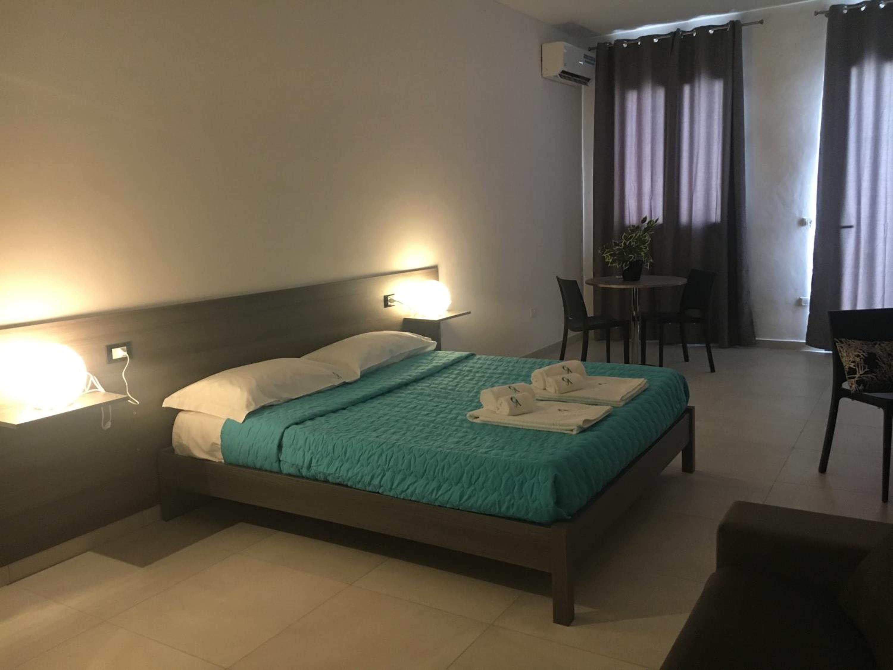Deluxe Quadruple Room - Photo 13