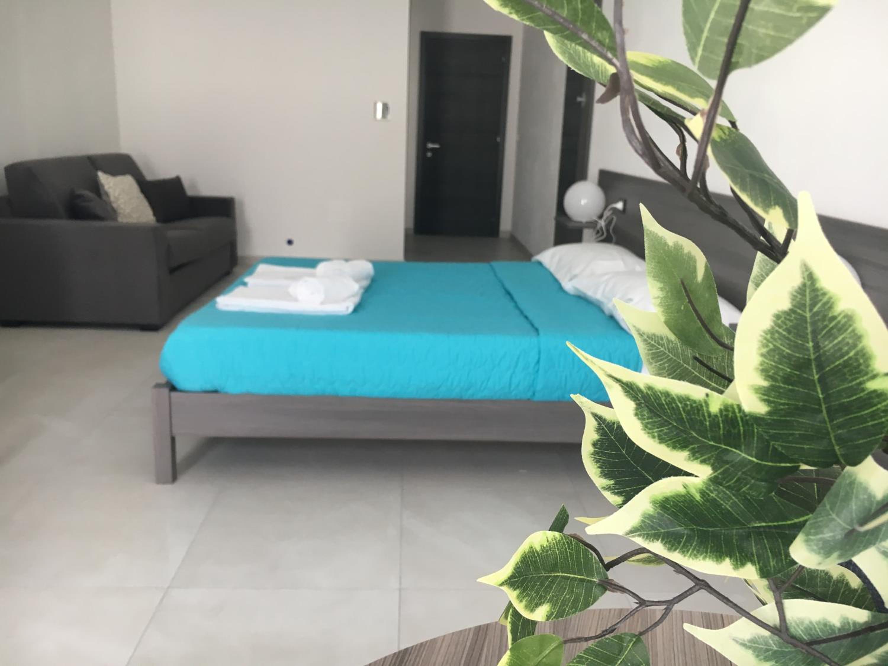 Deluxe Quadruple Room - Photo 12