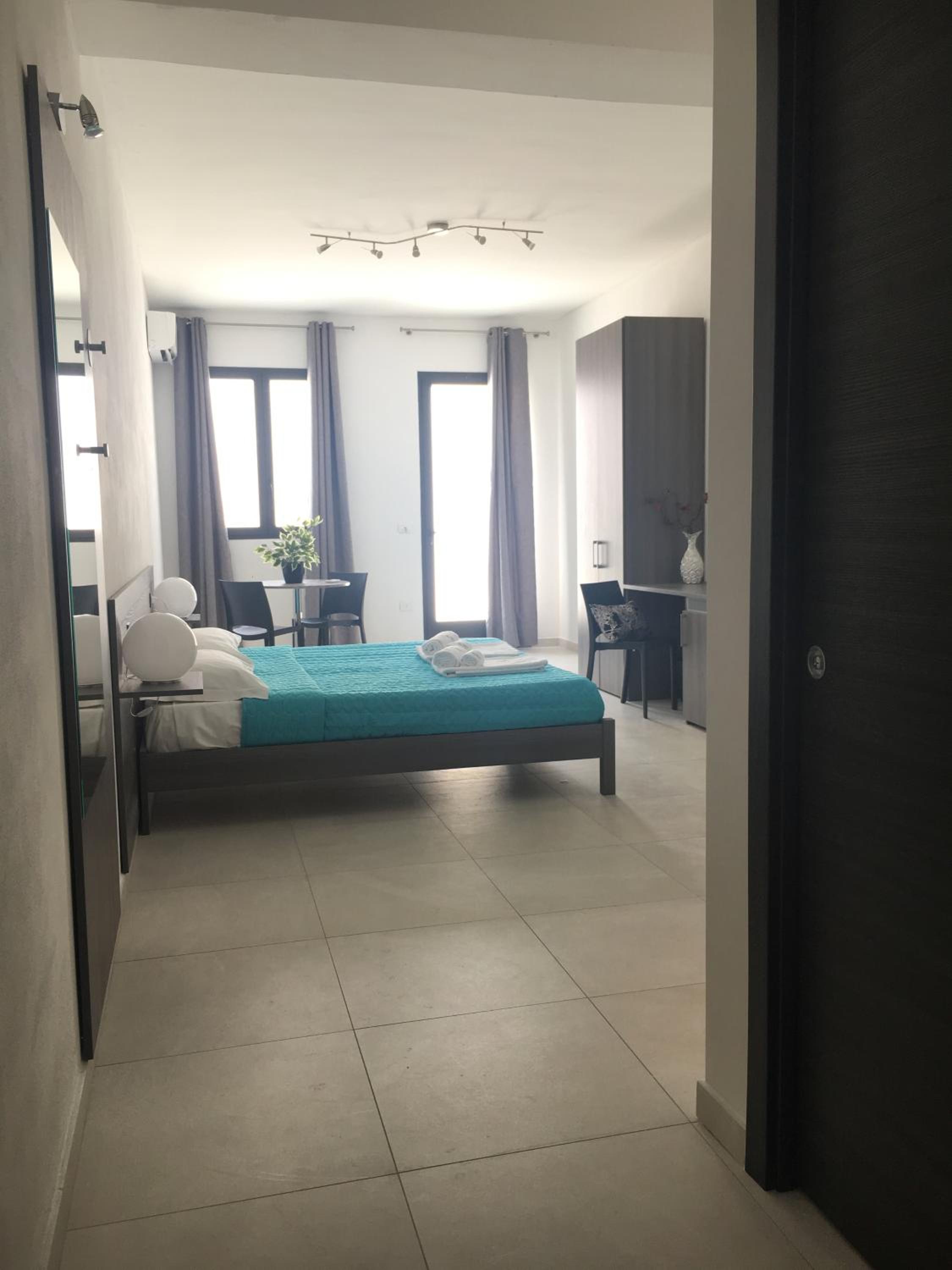 Deluxe Quadruple Room - Photo 14