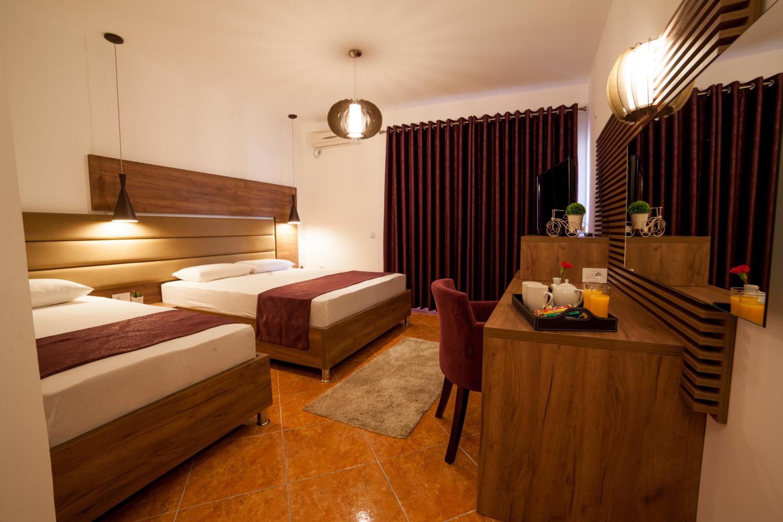Deluxe Triple Room with Balcony and Garden View