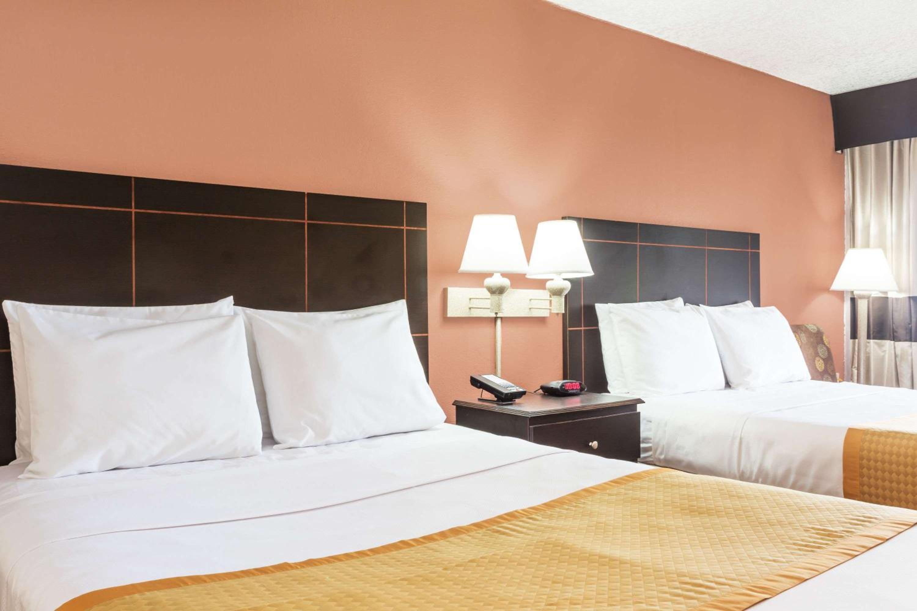Queen Room with Two Queen Beds - Smoking - Photo 1