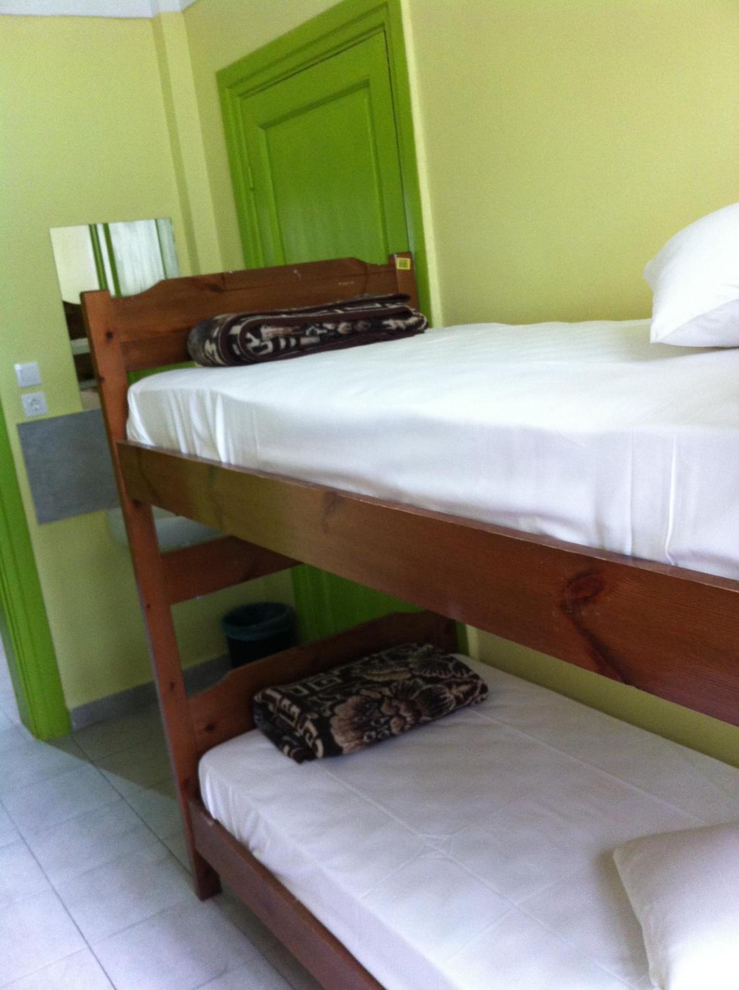 Bed in Quadruple Room with shared bathroom photo 1