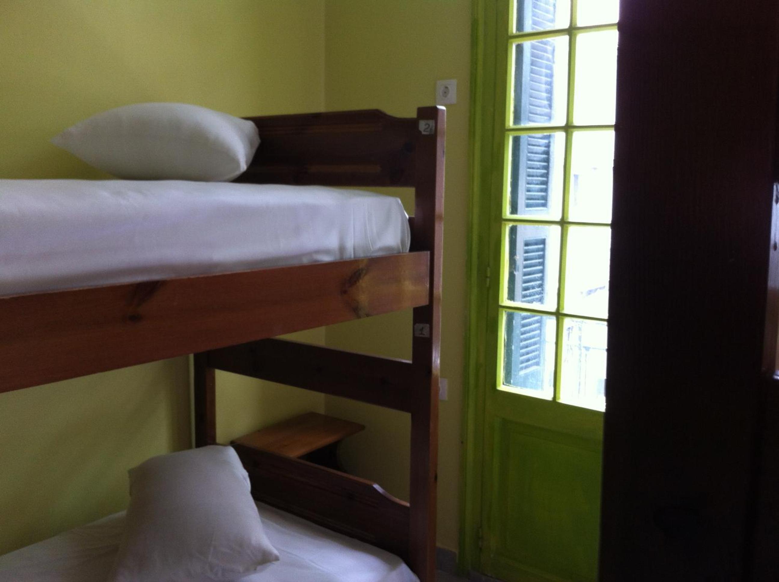 Bed in Quadruple Room with shared bathroom photo 2