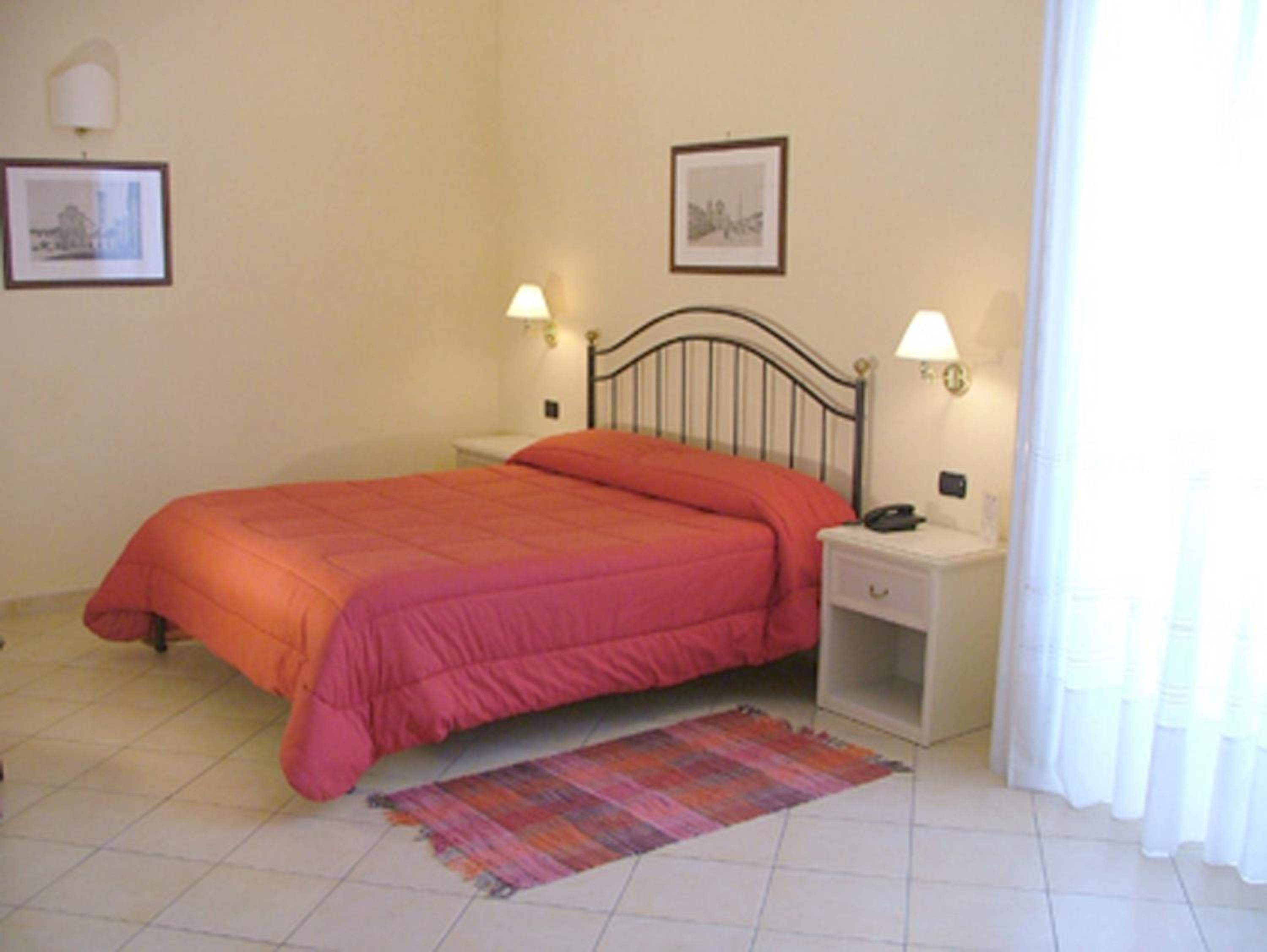 Quadruple Room with Balcony and City View photo 1