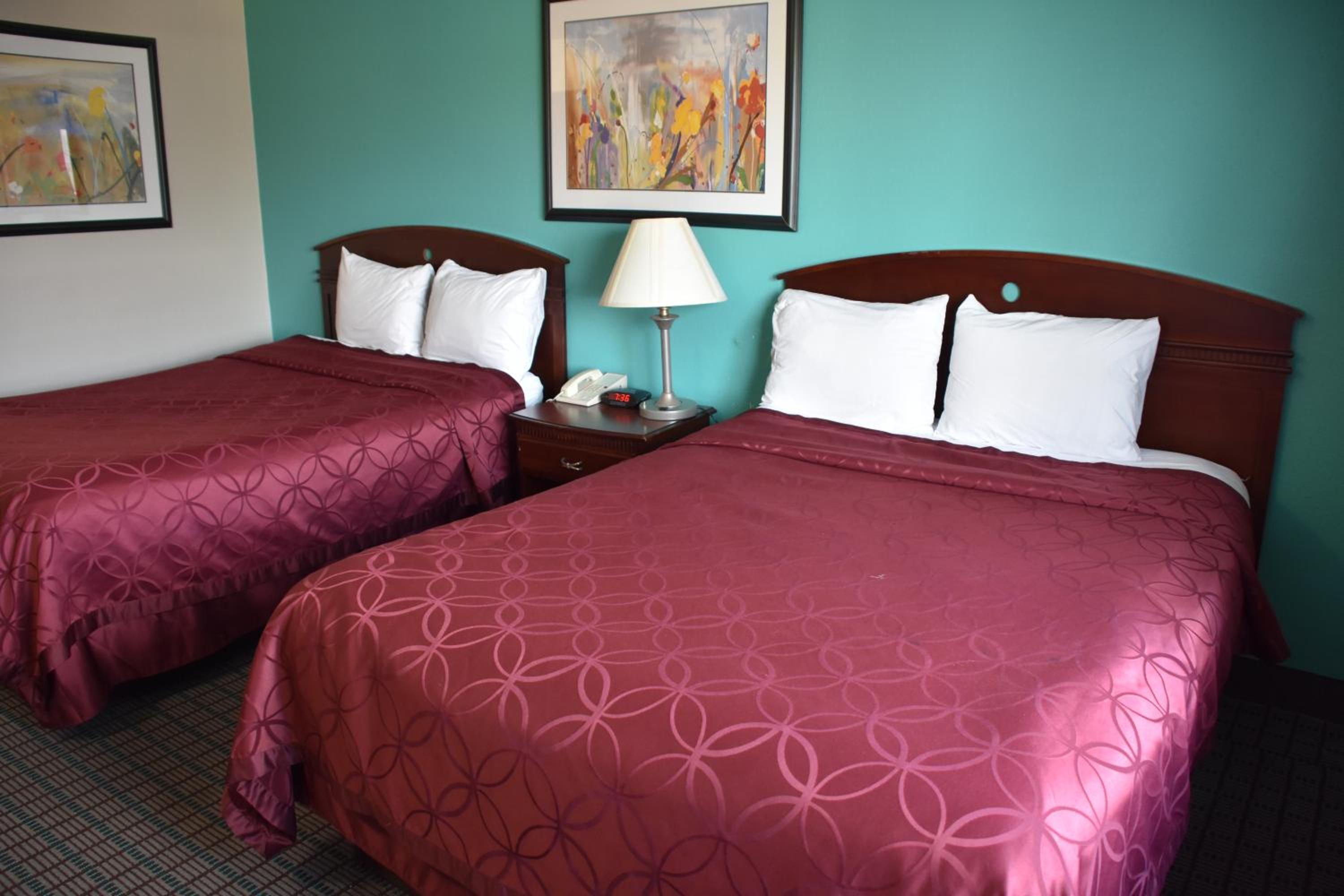 Queen Room with Two Queen Beds - Smoking - Photo 1