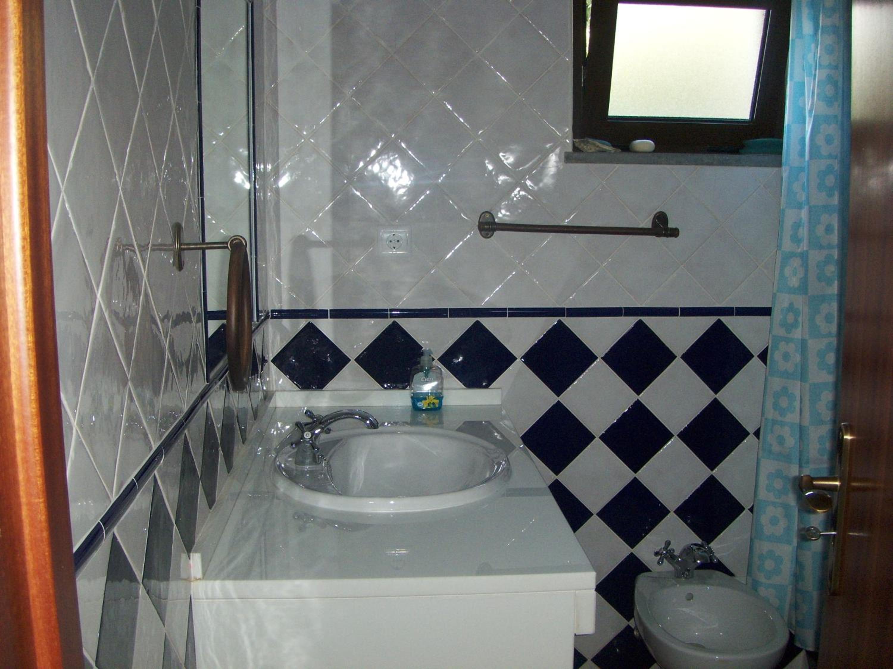 Three-Bedroom House - Photo 23