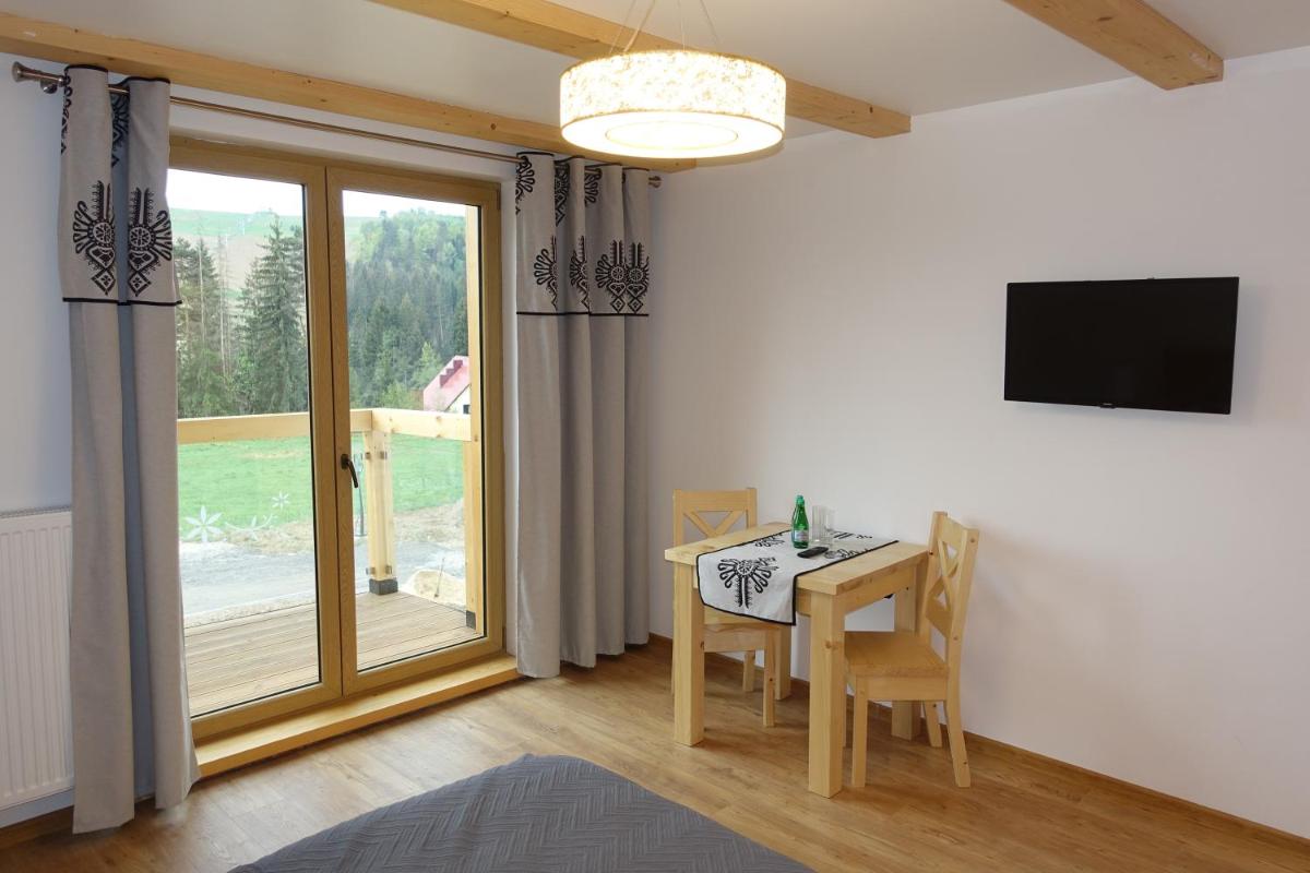 Deluxe King Room with Balcony - Photo 2
