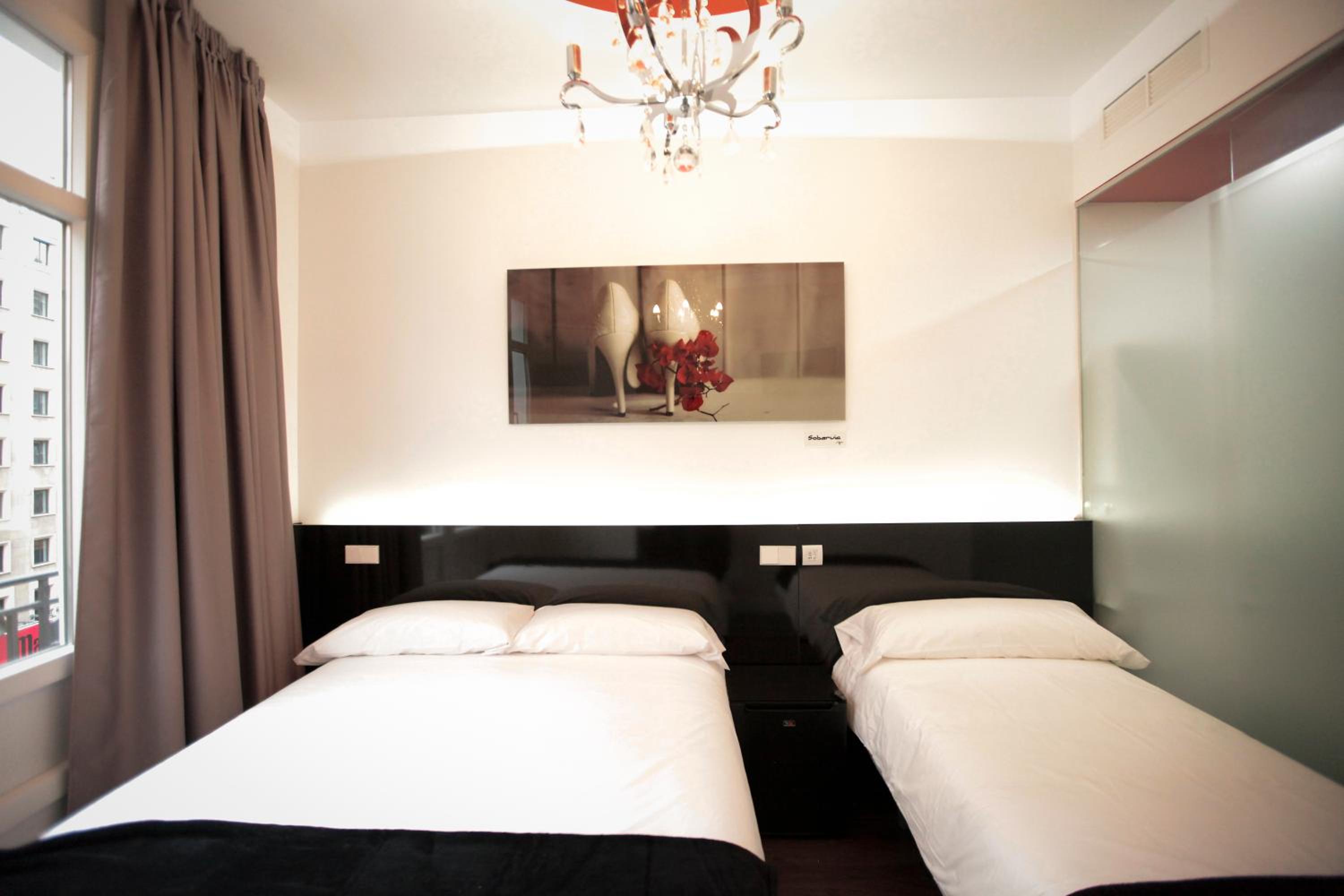 Habitación Doble con cama supletoria (2 adultos + 1 niño)