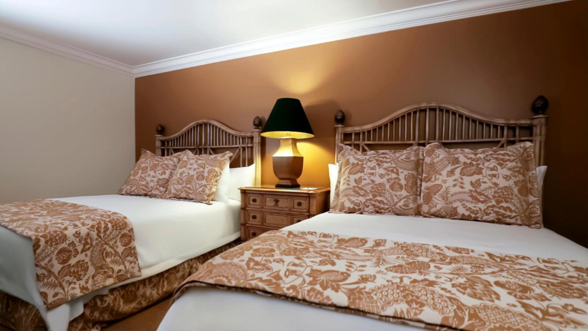 Queen Room with Two Queen Beds - Photo 1