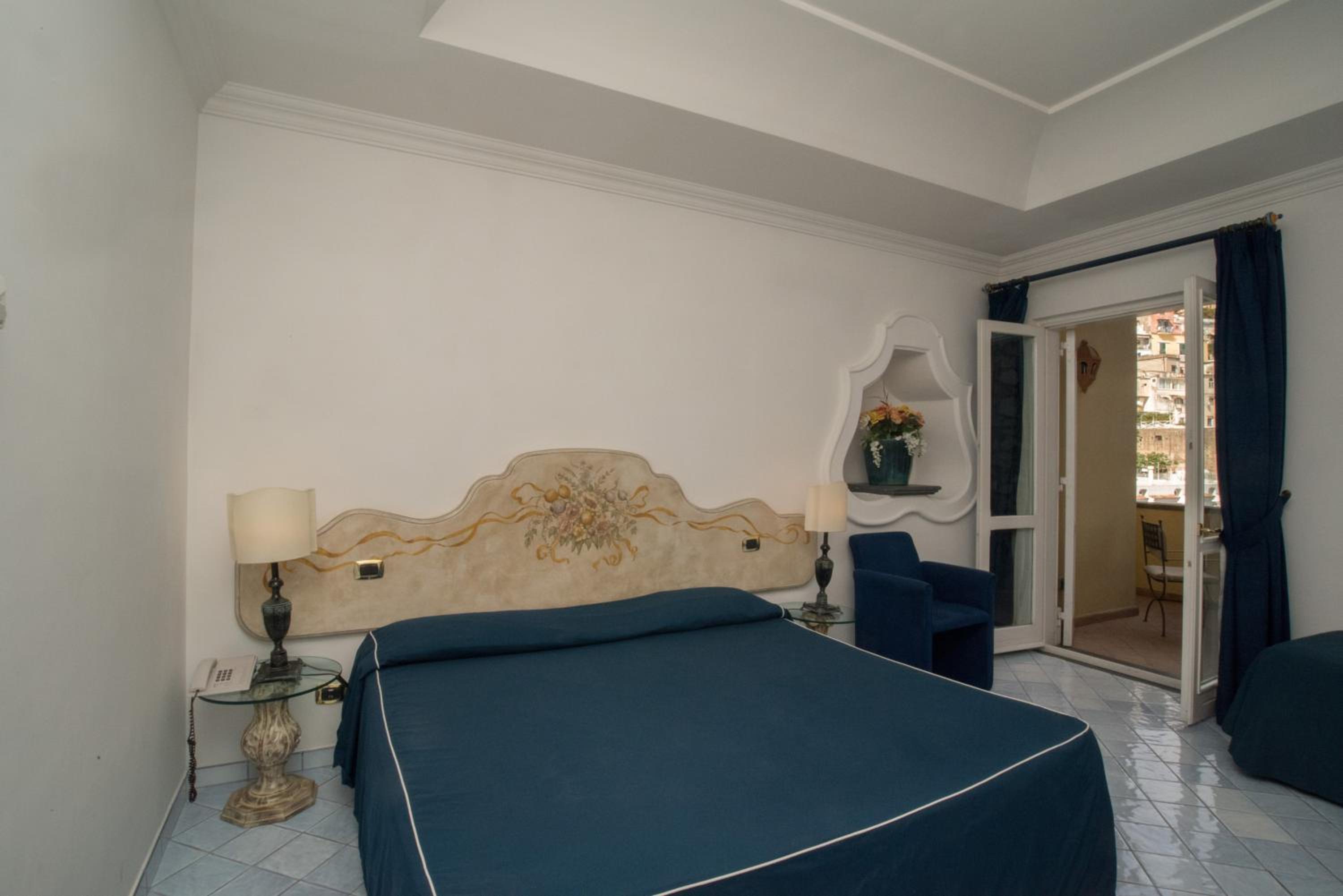 Deluxe Triple Room with Partial Sea View - Photo 1