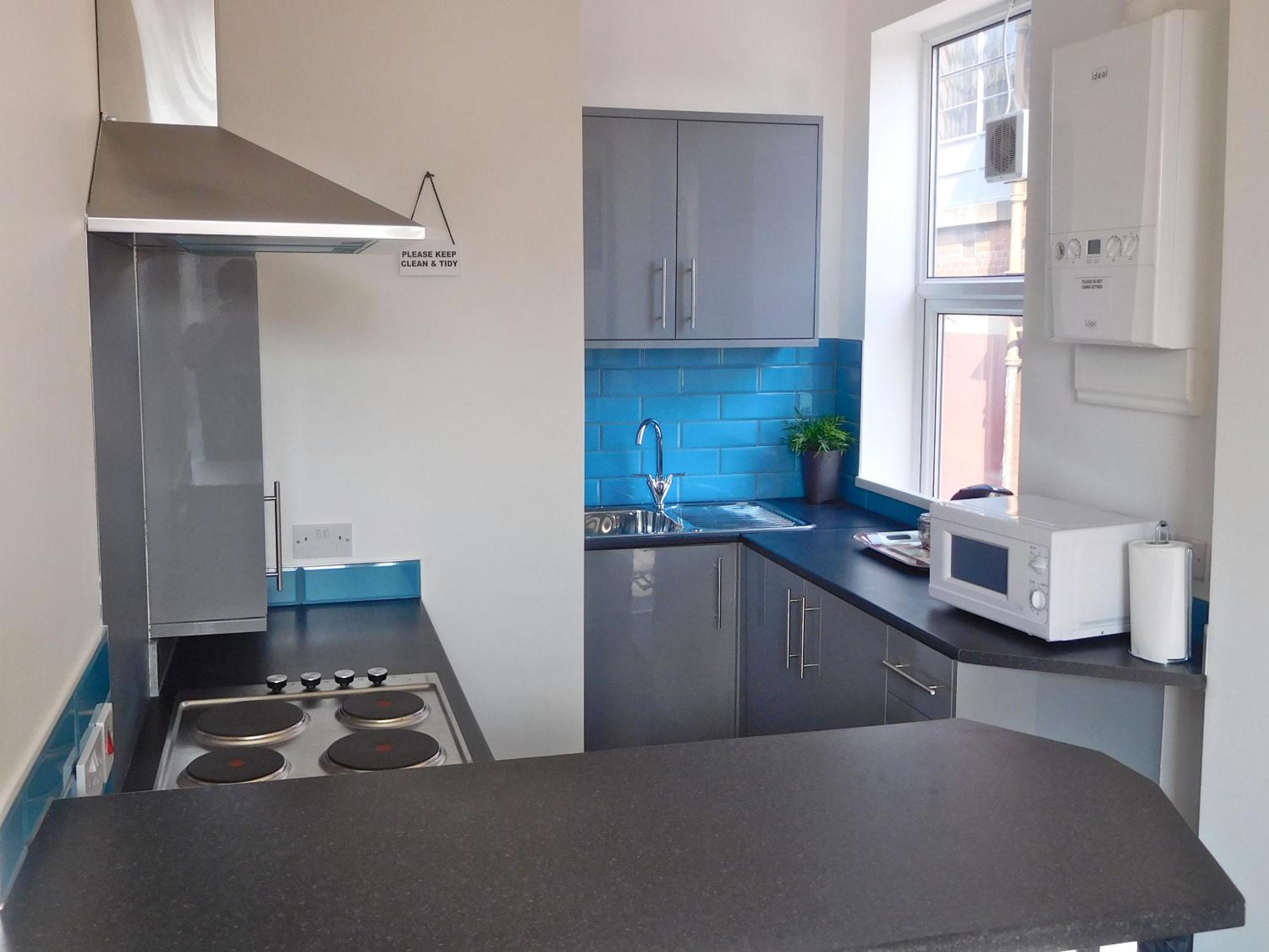 Three-Bedroom Apartment - Photo 5