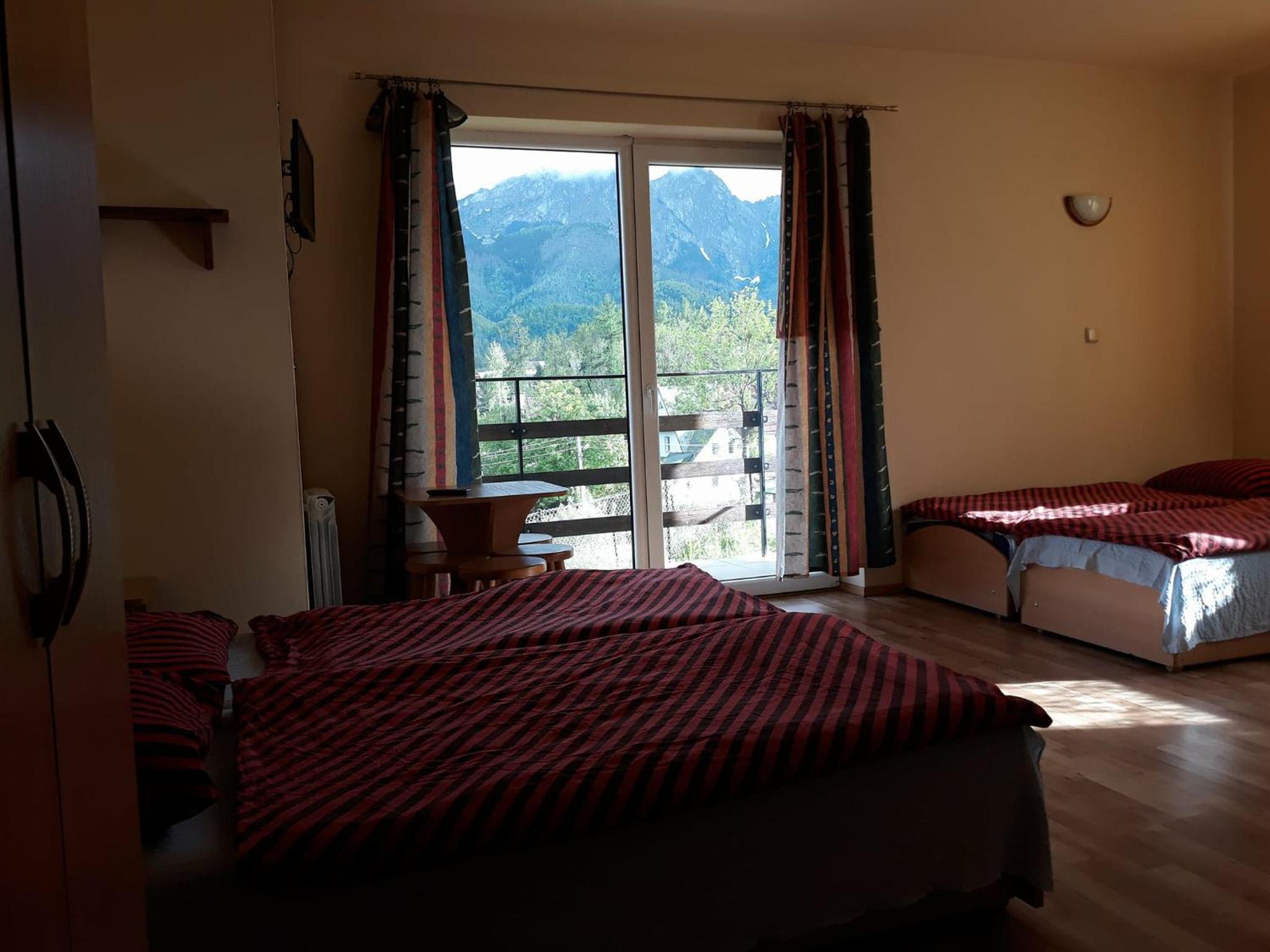 Family Room with Balcony - Photo 1