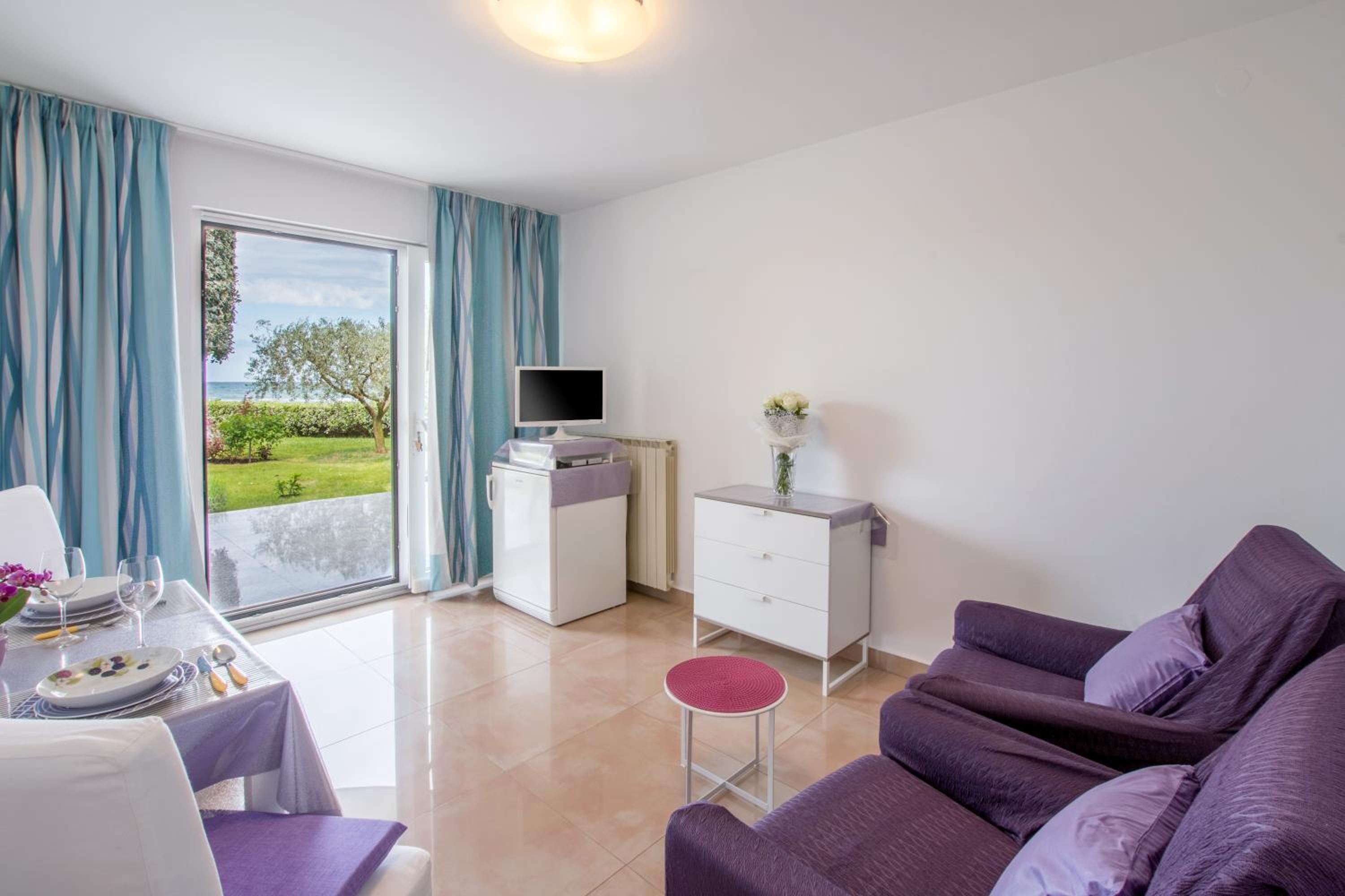 One-Bedroom Apartment with Patio and Sea View