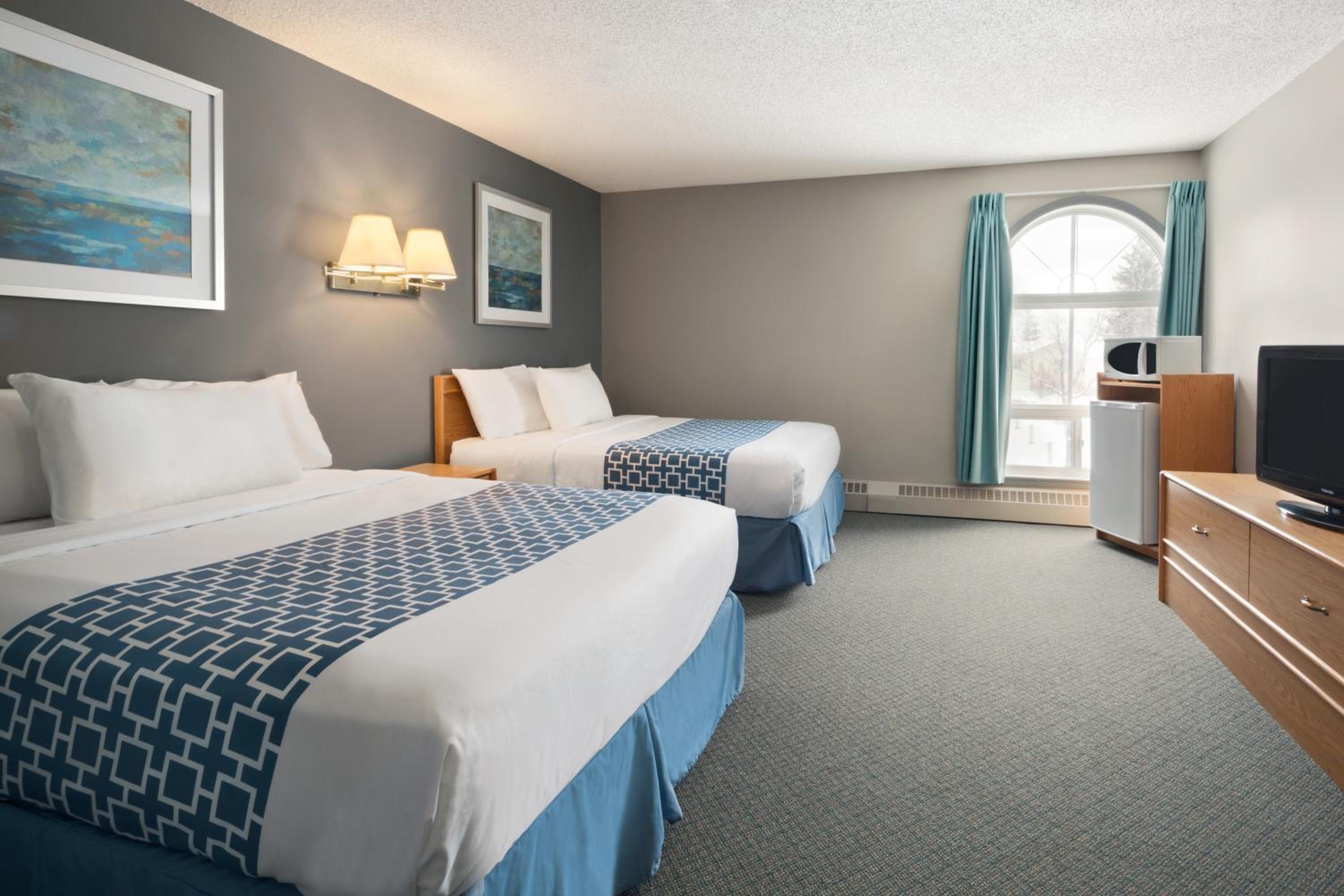 Deluxe Queen Room with Two Queen Beds - Photo 1