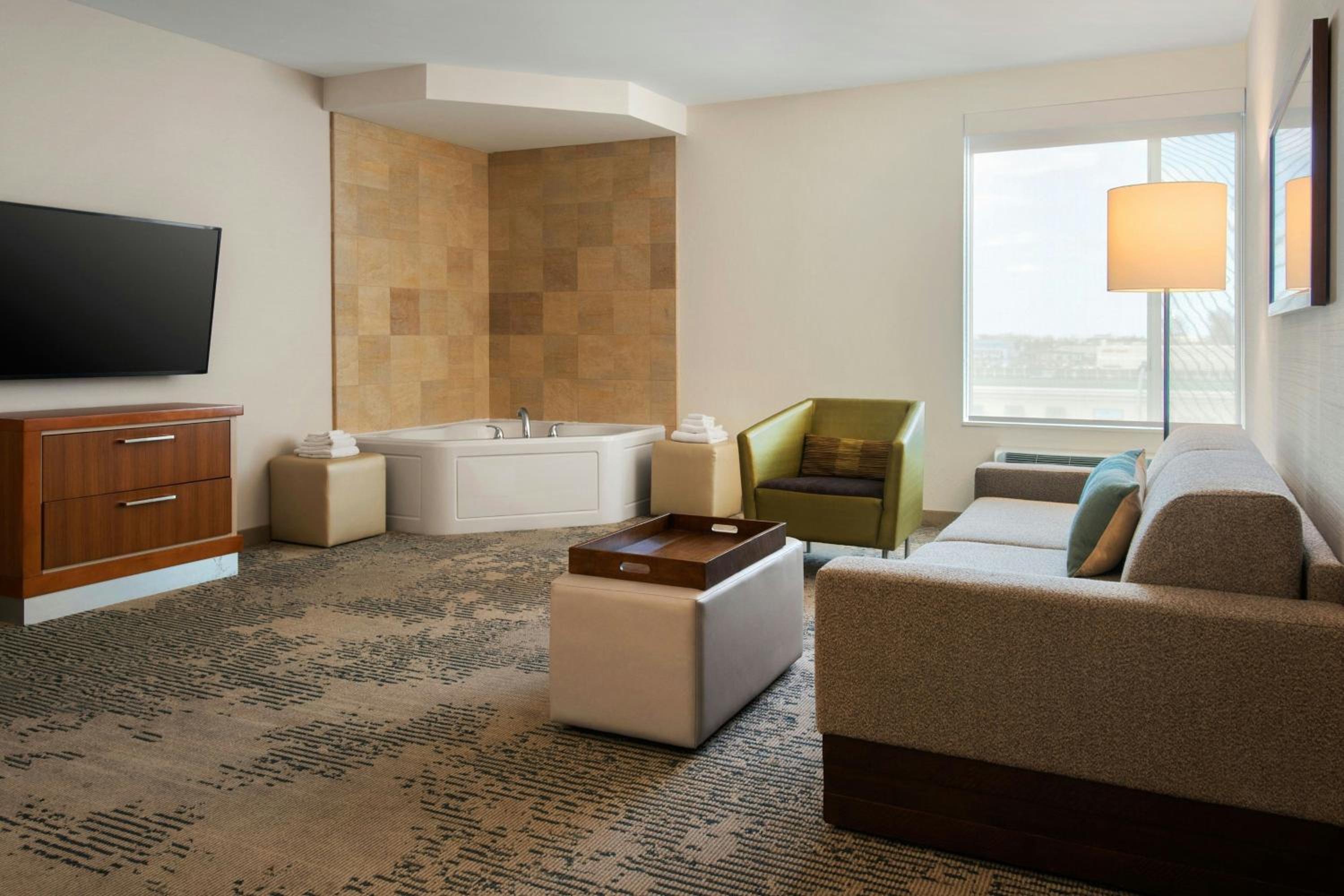 King Suite with Specialty Bathtub and Trundle Sofa