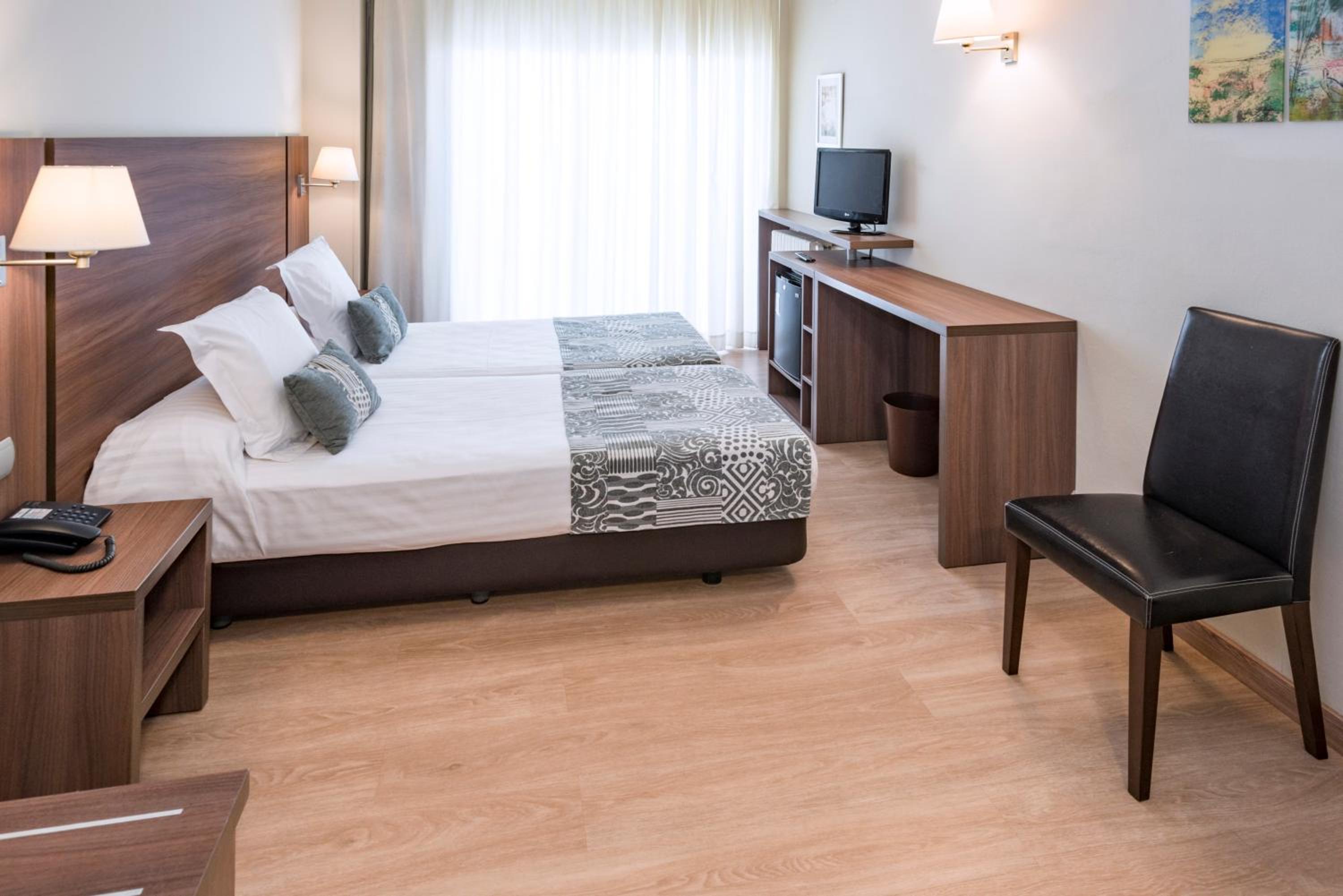 Habitación Doble (1 adulto + 1 niño)